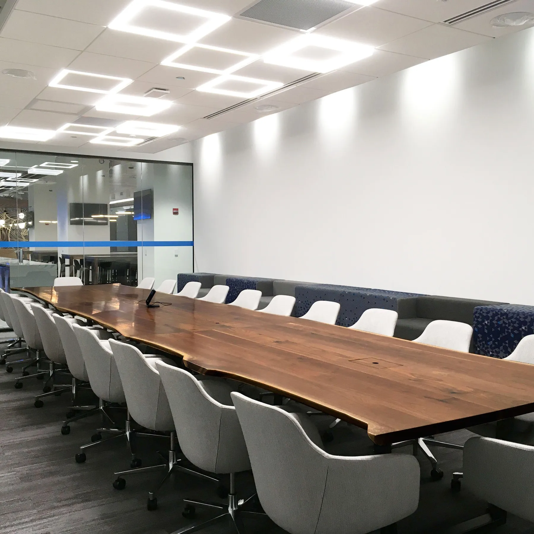 custom conference table in urban walnut live edge by Icon Modern