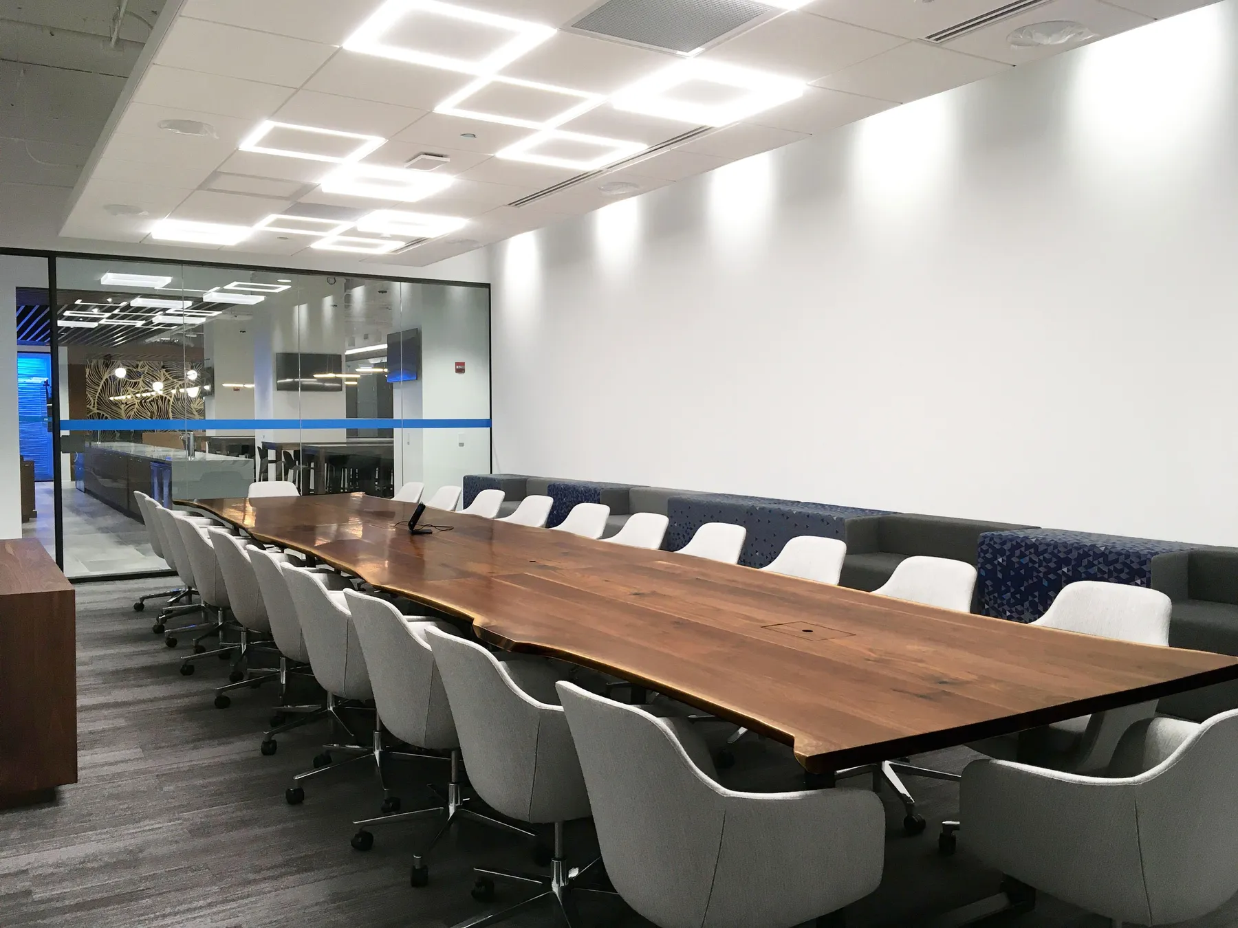 custom conference table in urban walnut live edge by Icon Modern