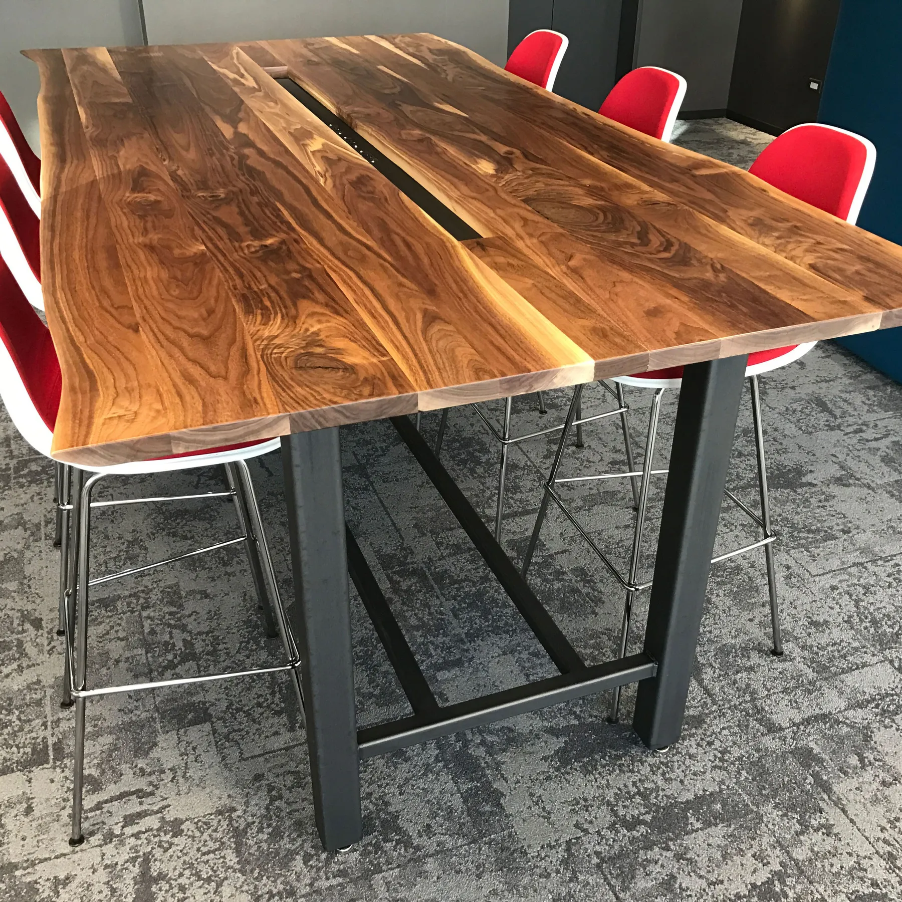 custom community table with center power strip by Icon Modern