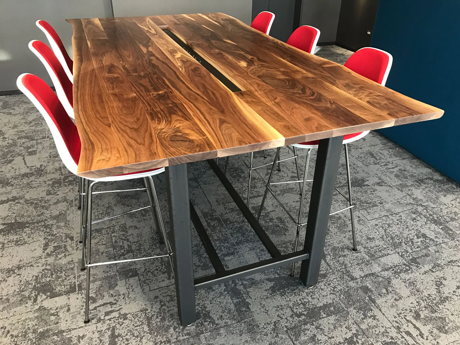 custom community table with center power strip by Icon Modern