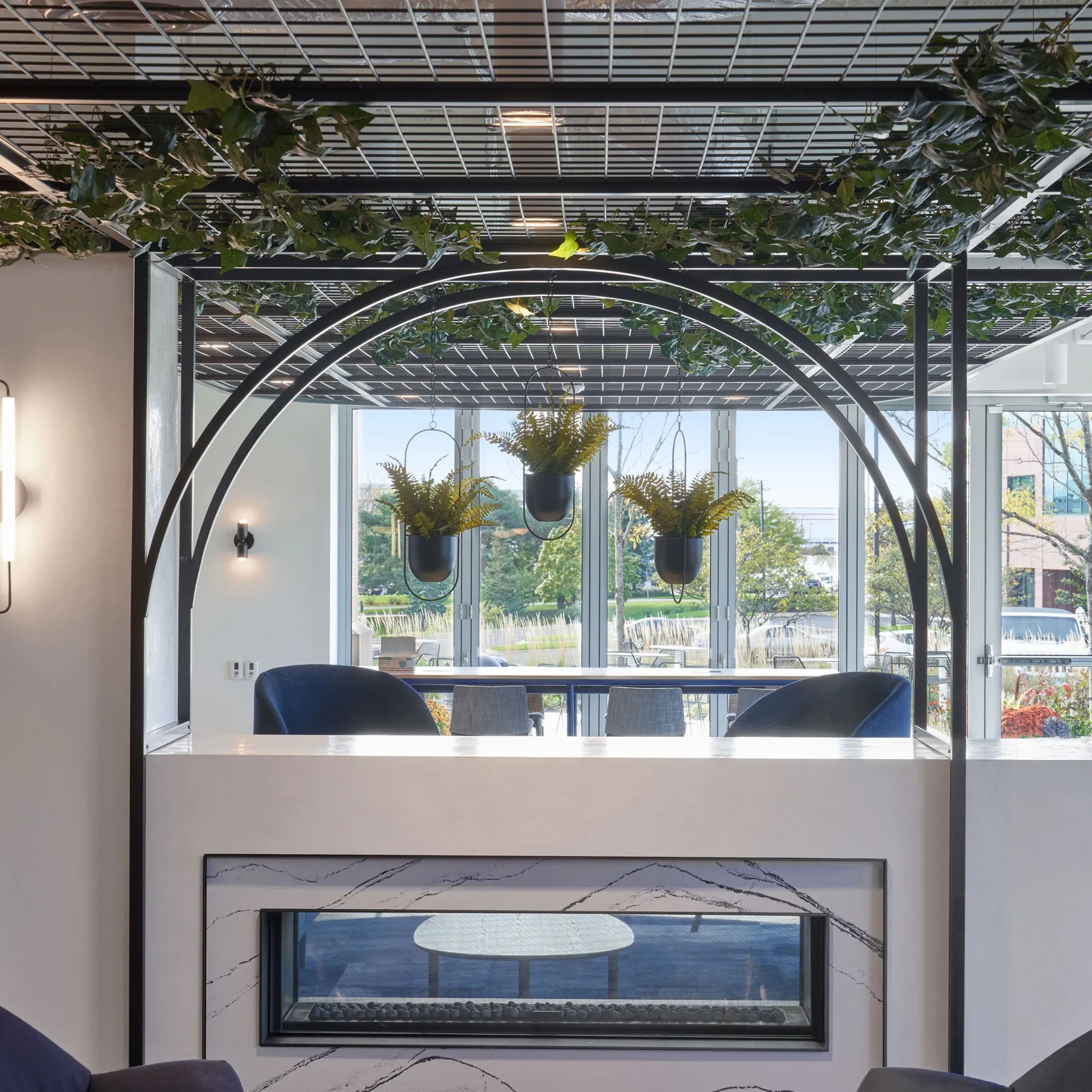 custom steel arches and fireplace surround by Icon Modern