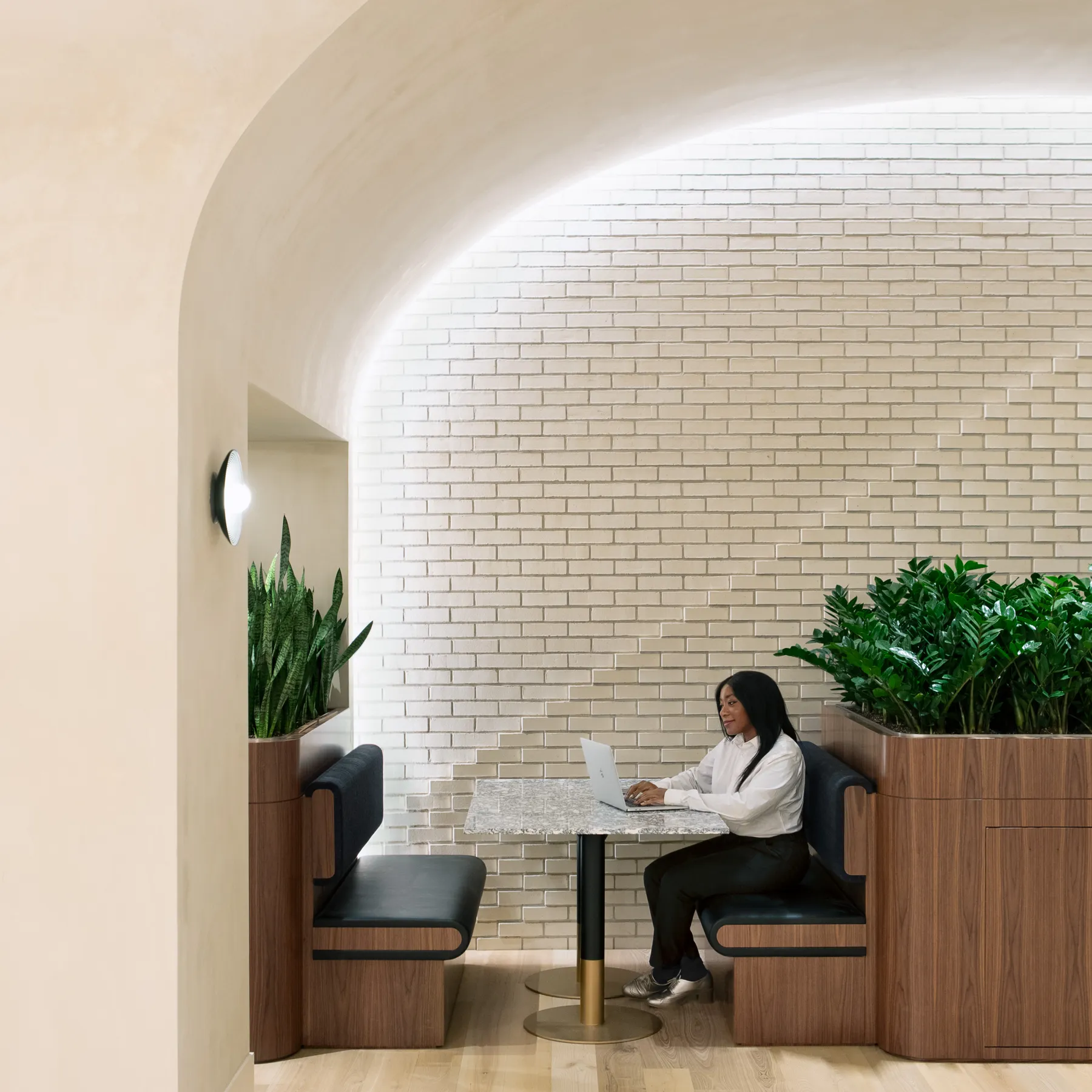 custom stone cafe tables + brass color powdercoated bases by Icon Modern