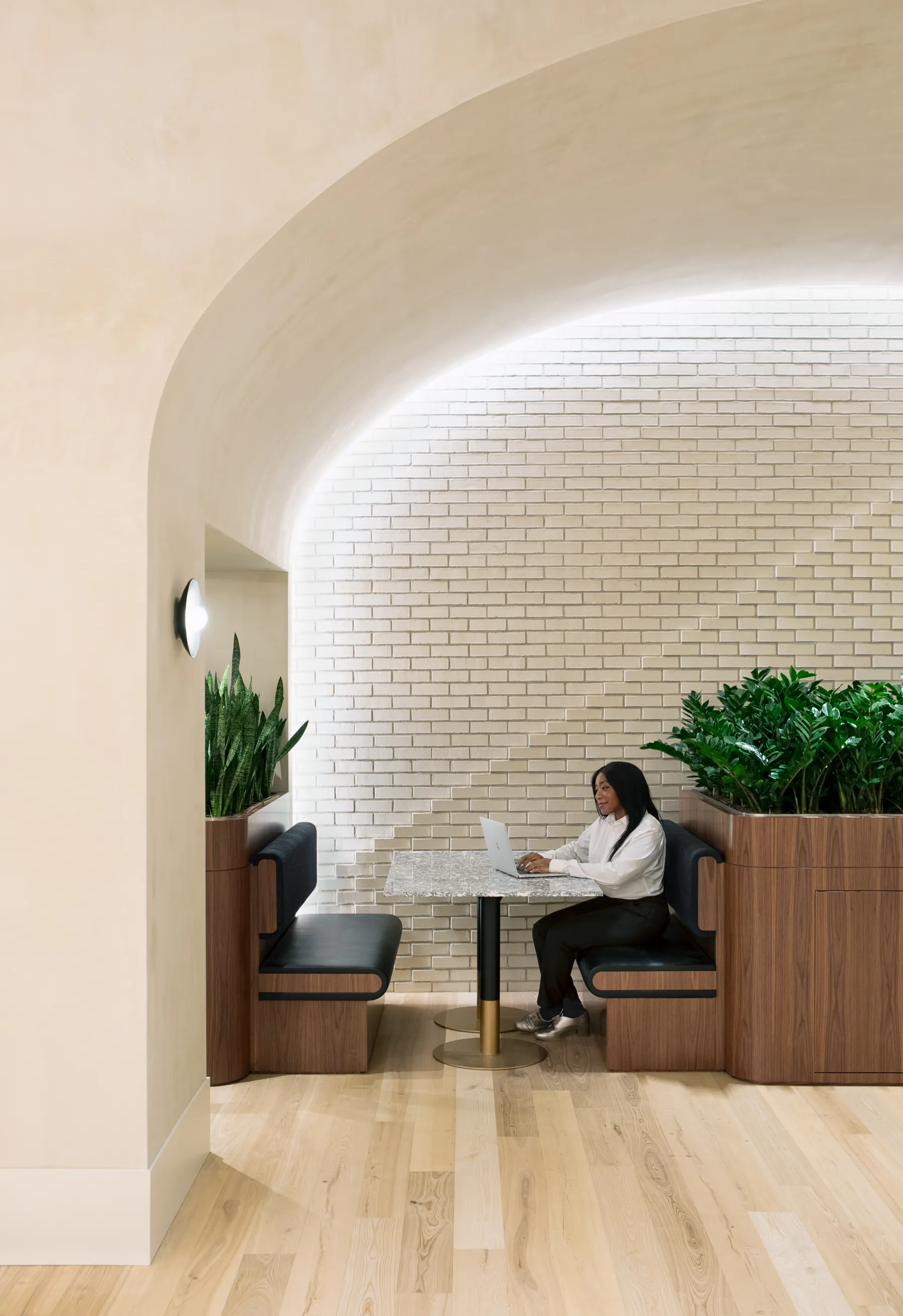 custom stone cafe tables + brass color powdercoated bases by Icon Modern