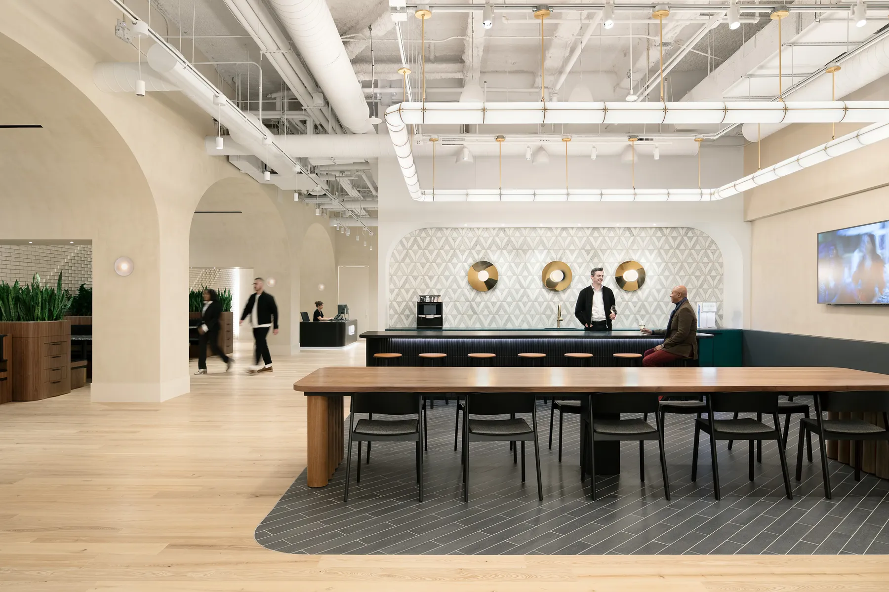 custom walnut veneer work table + multi-dowel panel base + power integration by Icon Modern