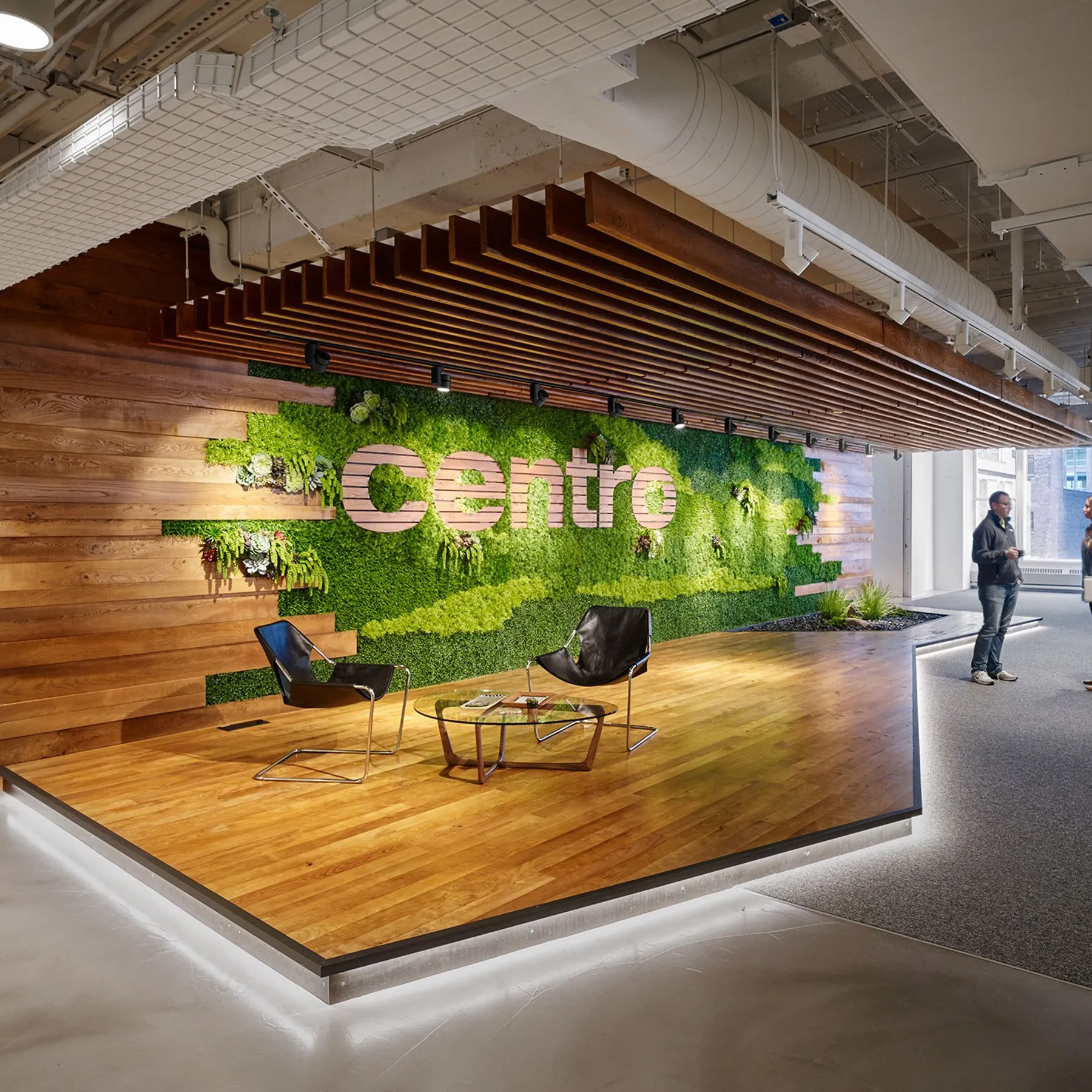 custom cladding in urban ash with wall signage by Icon Modern