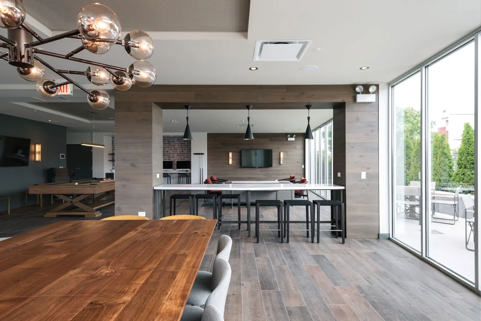 custom community tables walnut and solid surface by Icon Modern