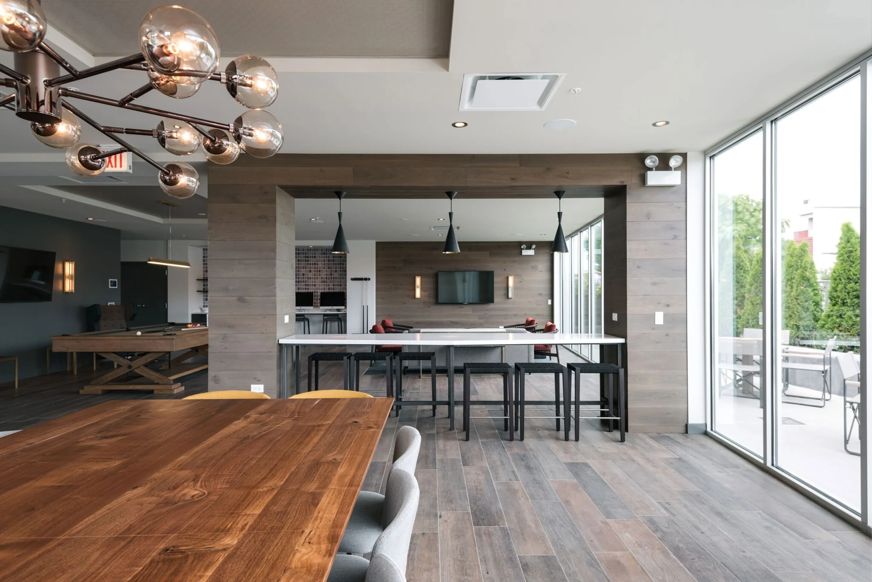 custom community tables walnut and solid surface by Icon Modern