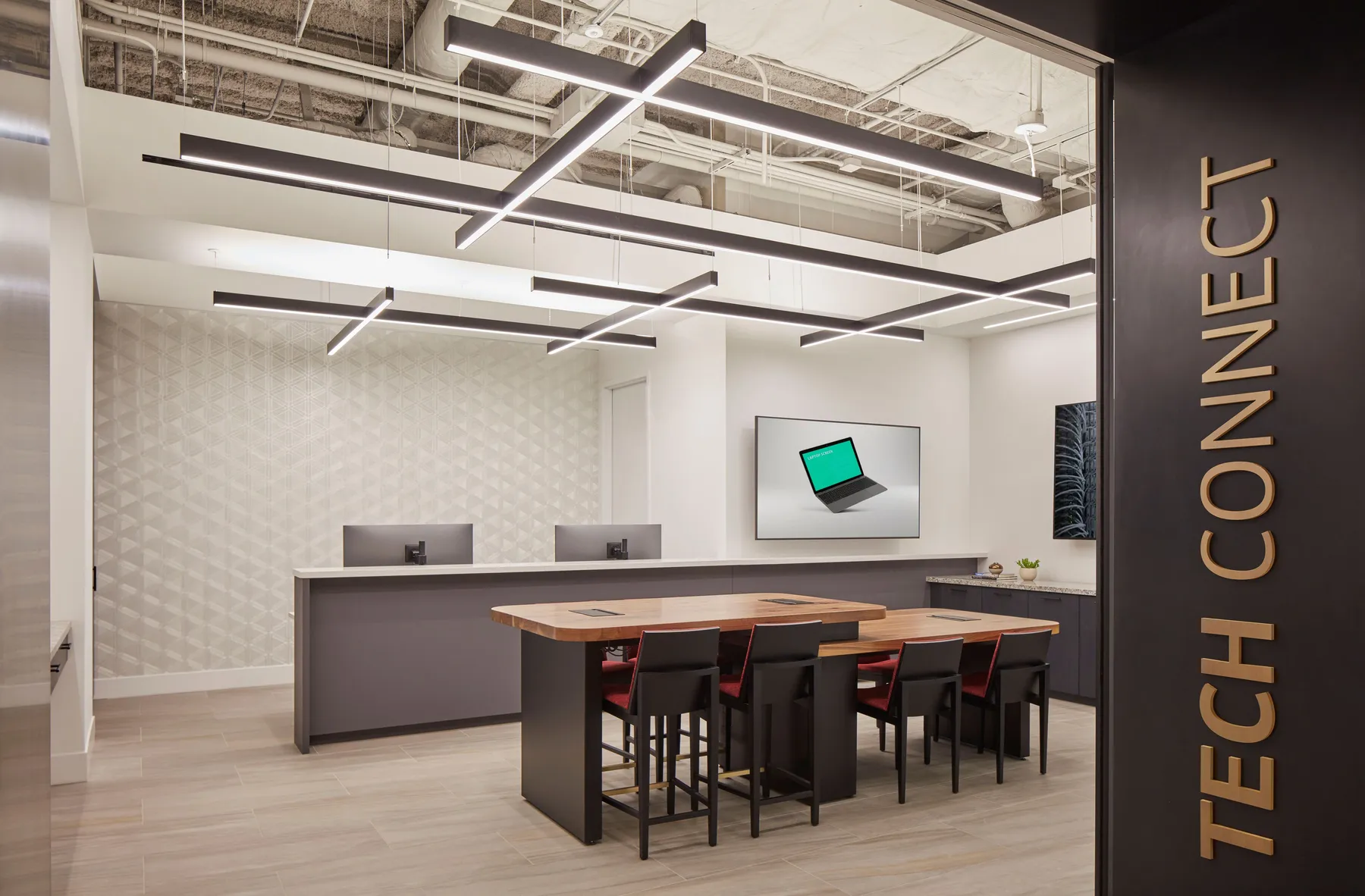 custom walnut conference table with two-tier tops and power integration by Icon Modern