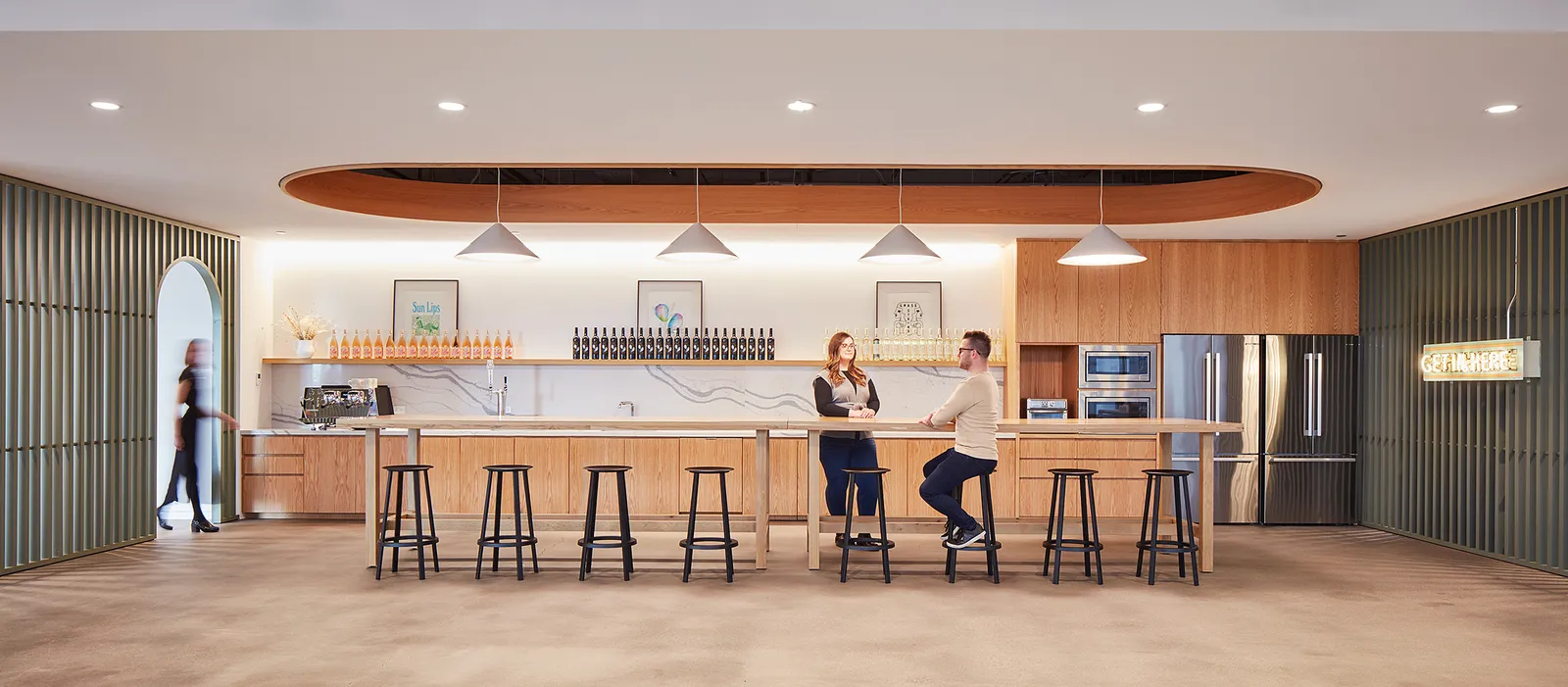 custom oak wood tables with footrests by Icon Modern