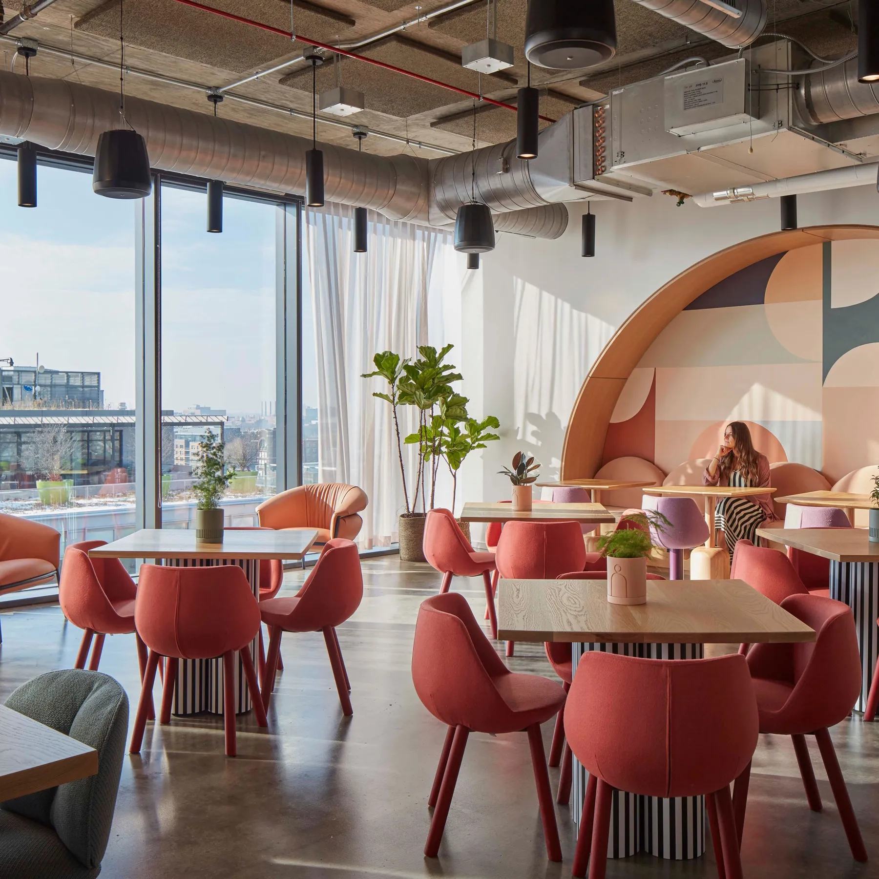 custom cafe tables in urban oak with custom painted drum bases by Icon Modern