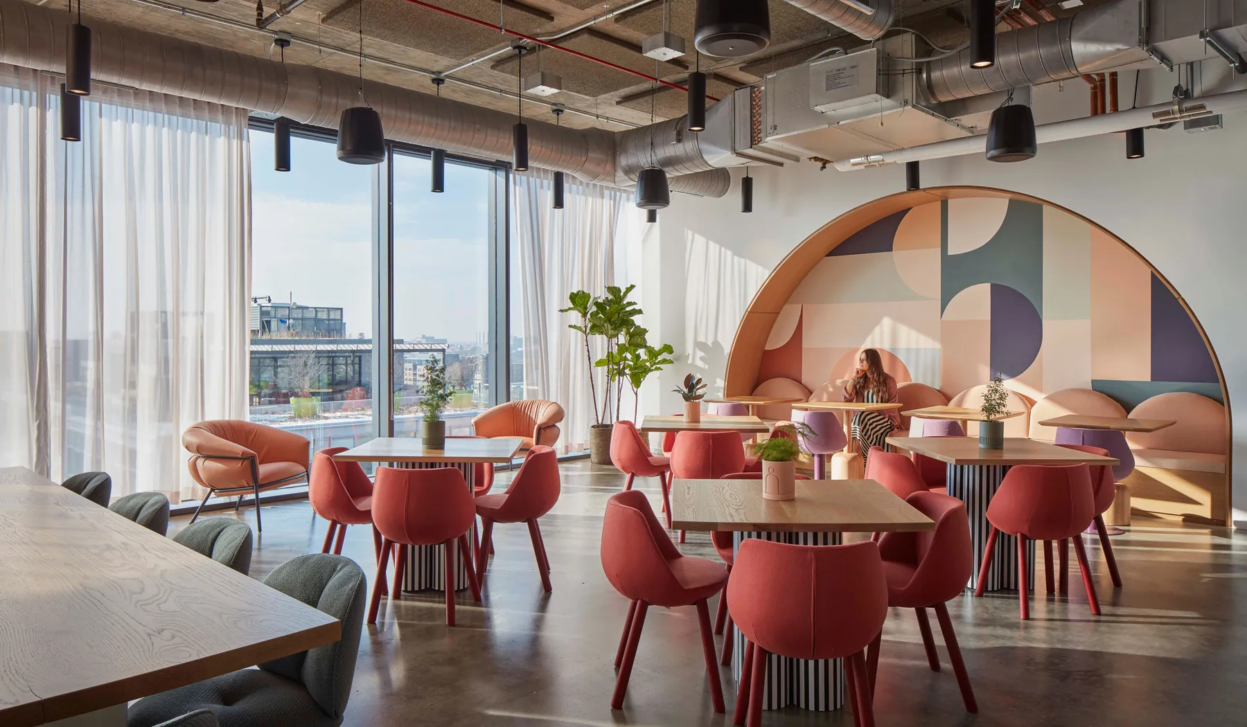 custom cafe tables in urban oak with custom painted drum bases by Icon Modern