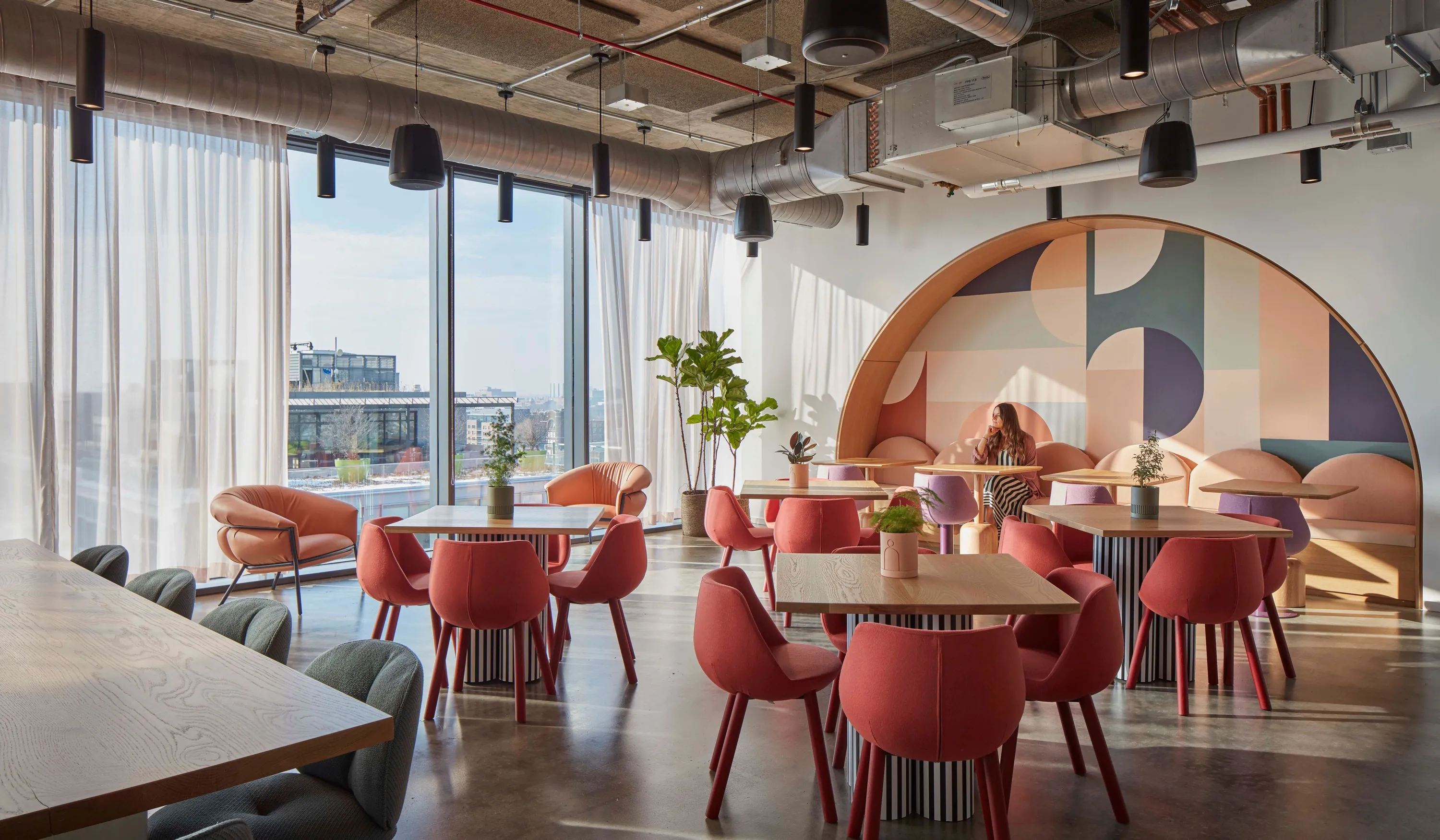 custom cafe tables in urban oak with custom painted drum bases by Icon Modern