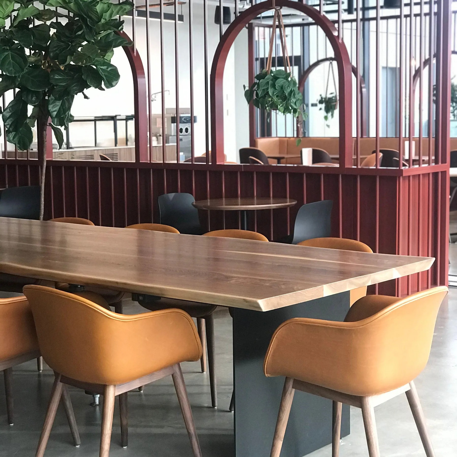 custom community table in urban walnut by Icon Modern