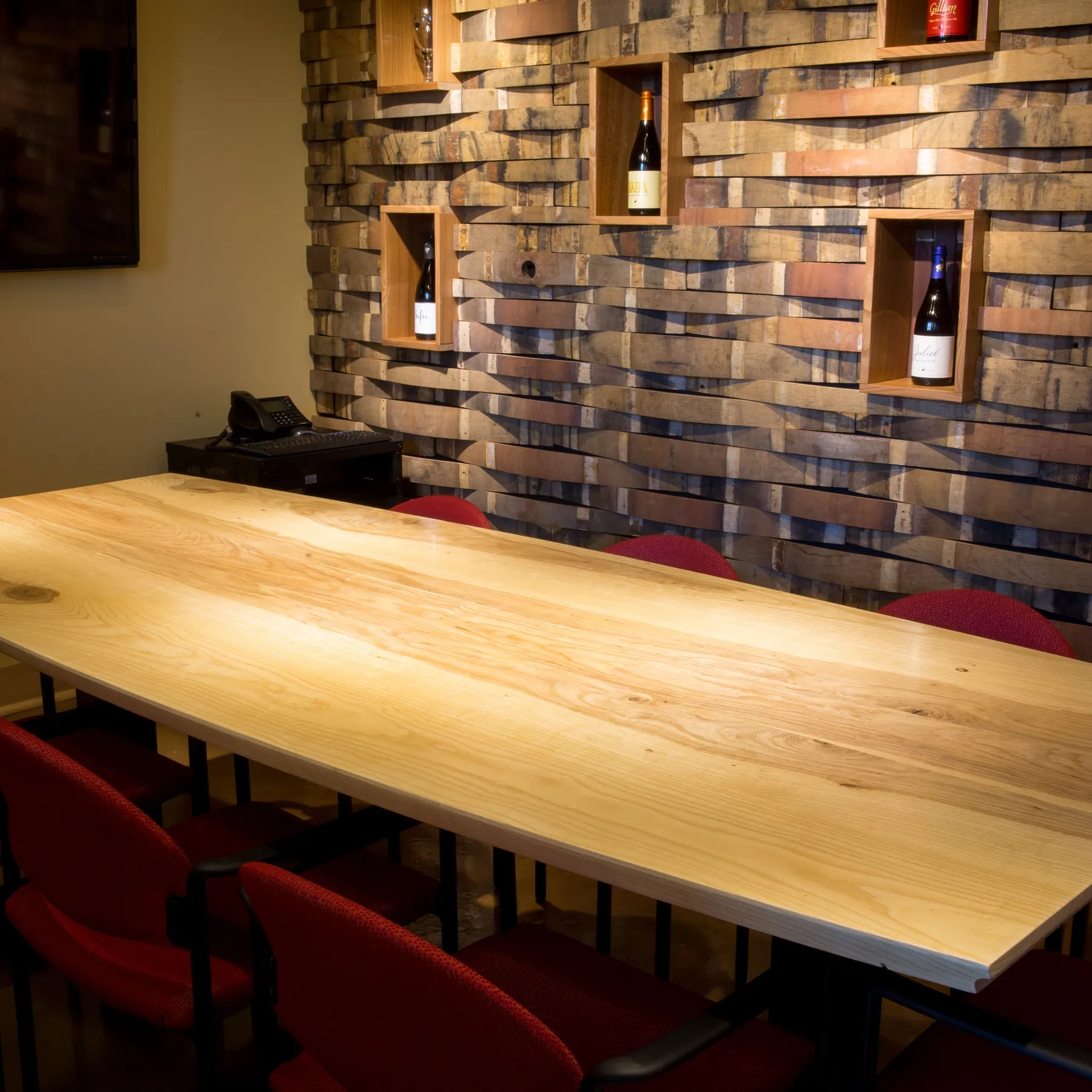 custom community table with barrel stave cladding by Icon Modern