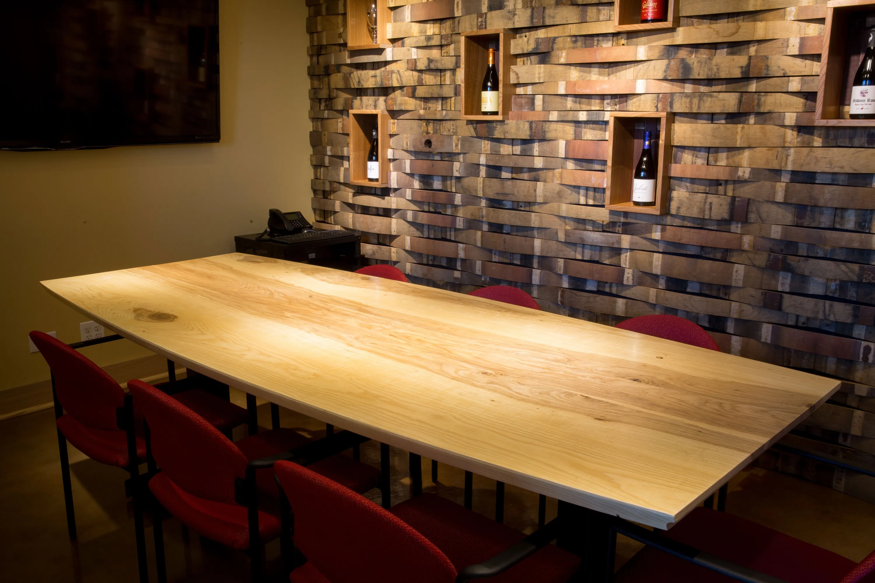 custom community table with barrel stave cladding by Icon Modern