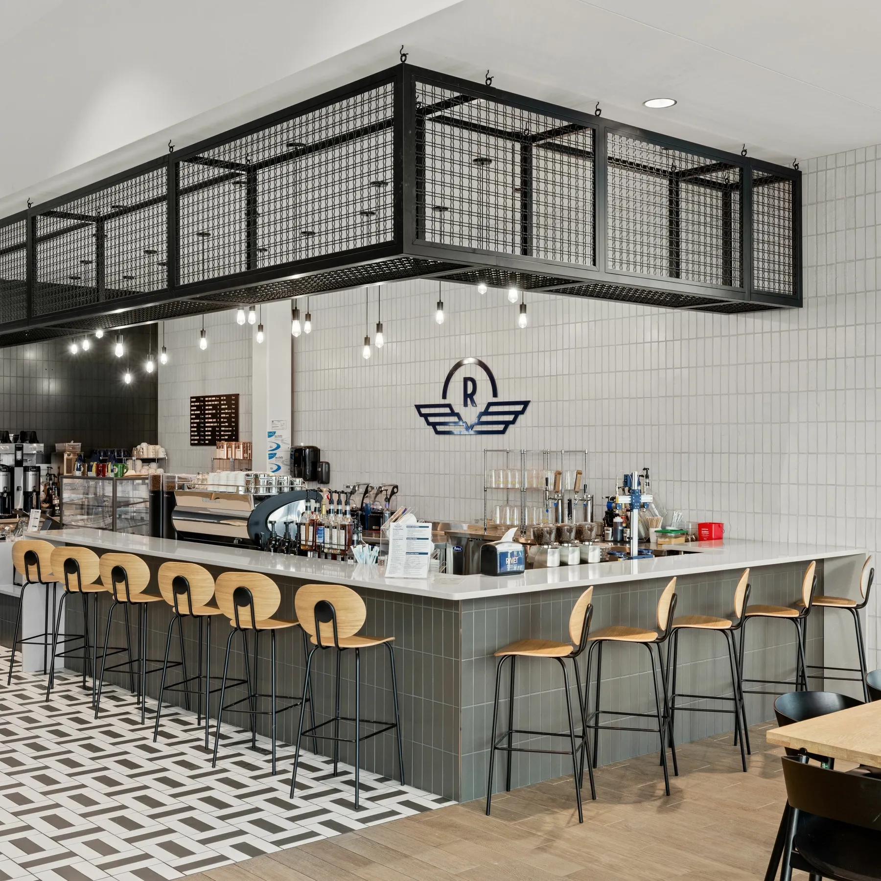 custom ceiling element in L-shape with steel tube and wire mesh infill by Icon Modern