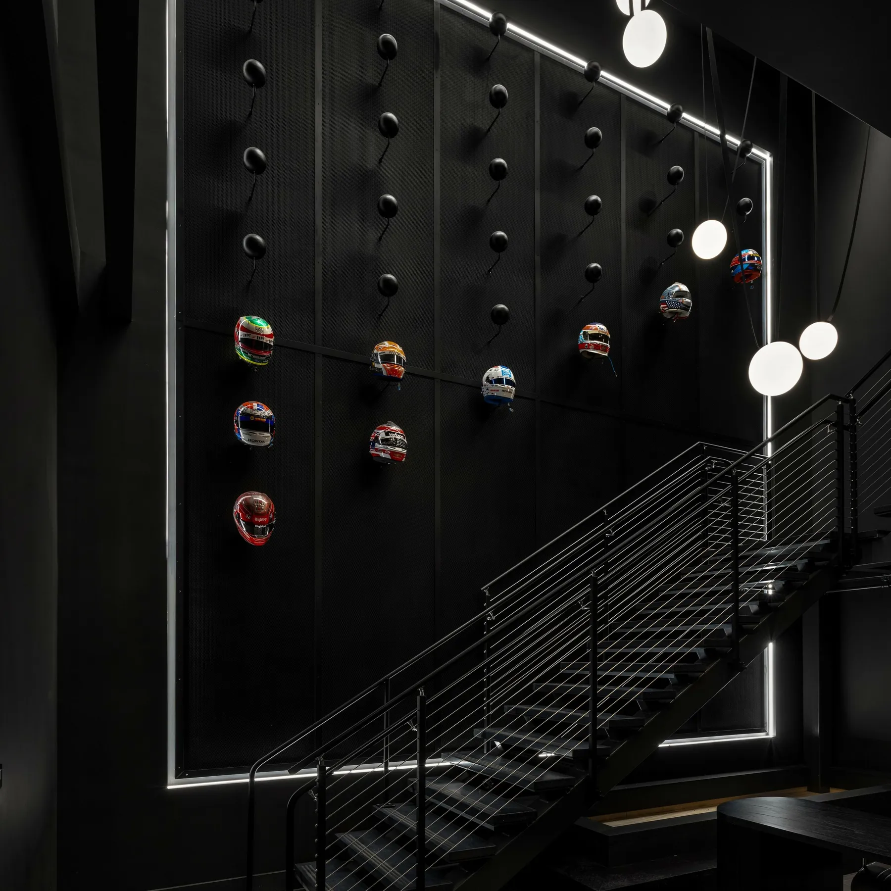 custom branded feature wall in steel with helmets by Icon Modern