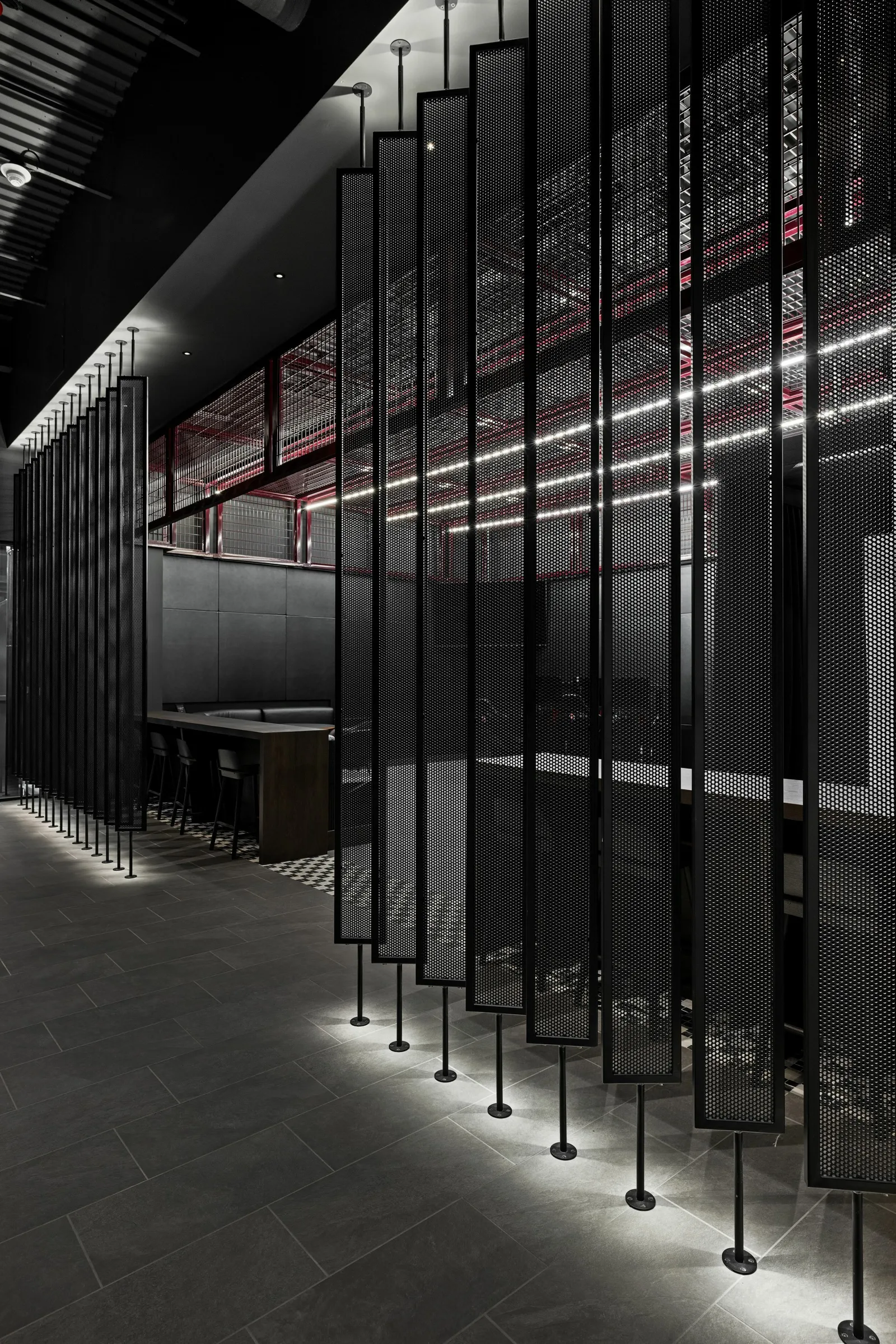 custom space dividers with steel tube frame and perforated infill by Icon Modern