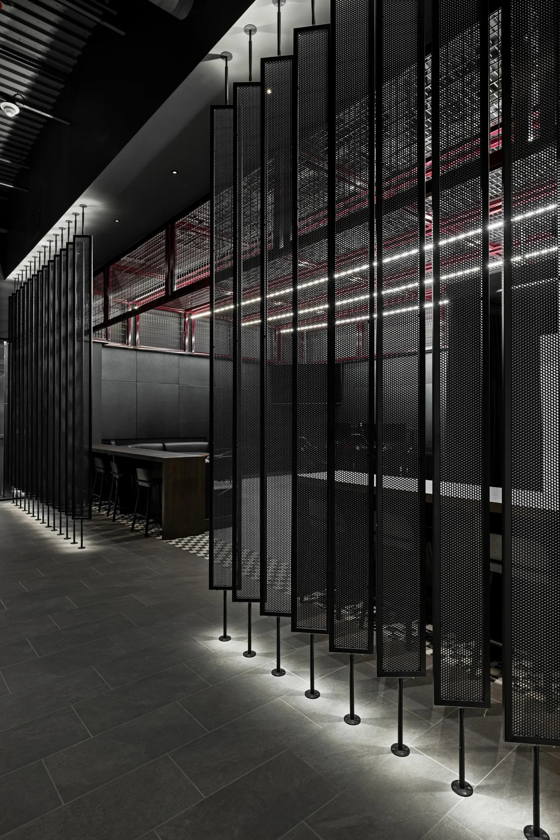 custom space dividers with steel tube frame and perforated infill by Icon Modern