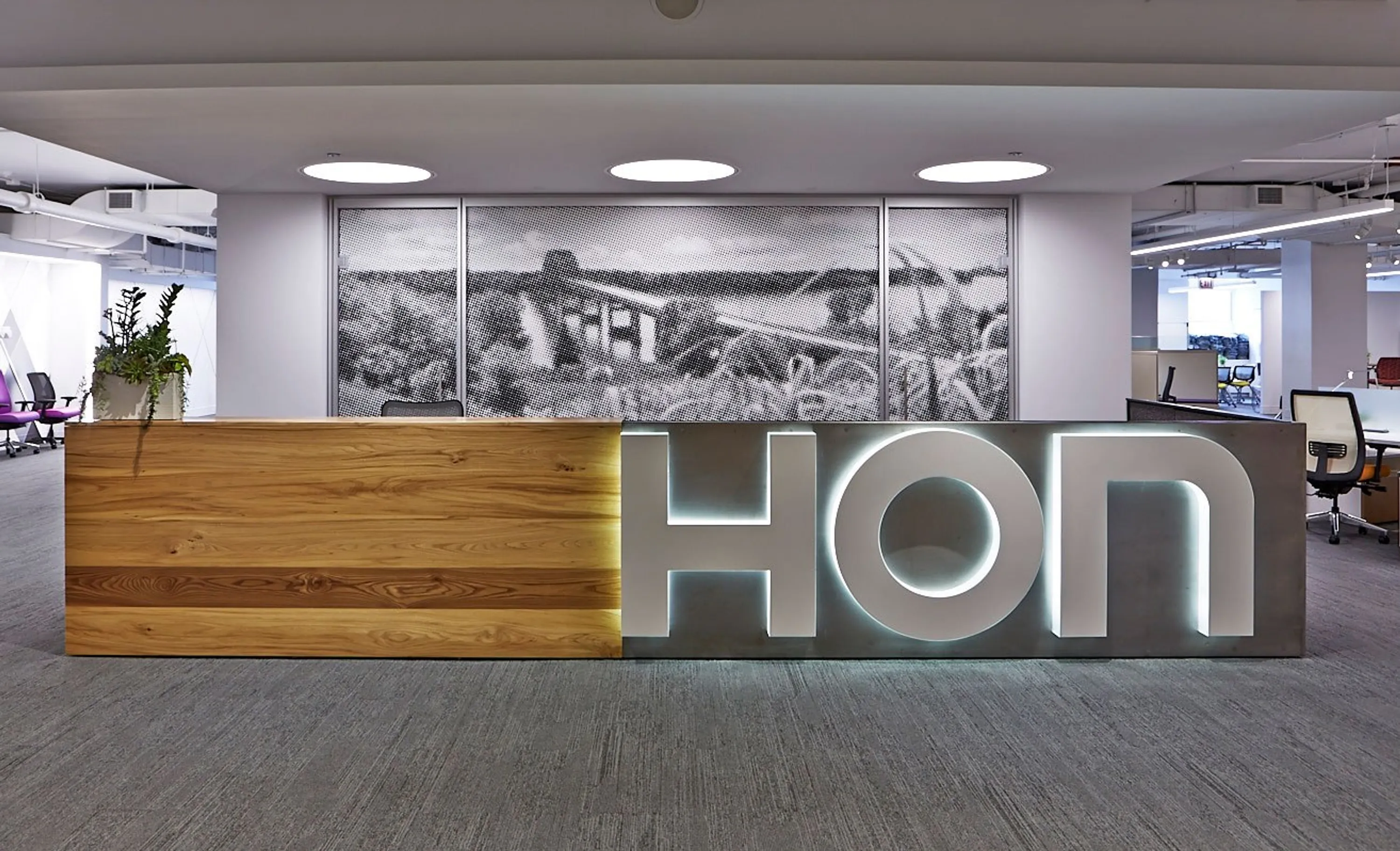 custom reception desk in urban elm with steel panel by Icon Modern