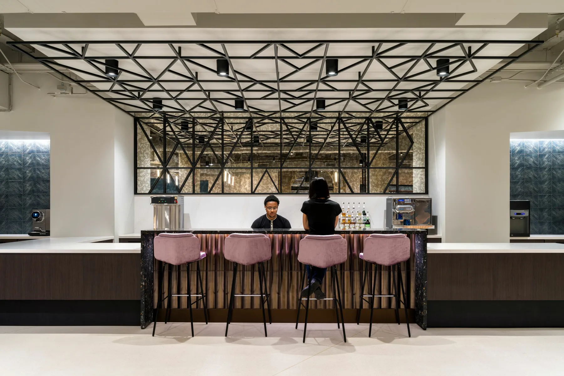 custom ceiling element and space divider in a custom steel tube pattern by Icon Modern