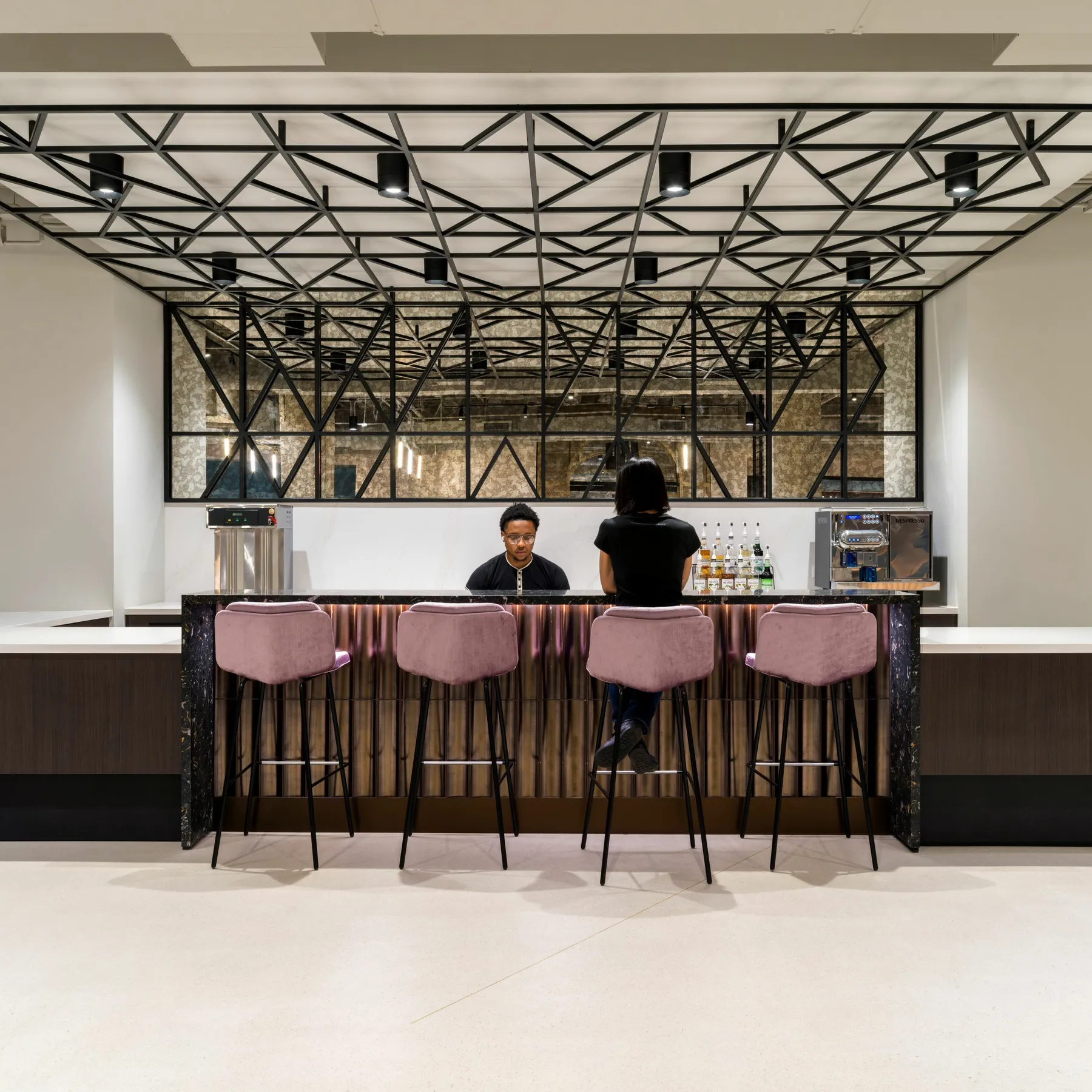 custom ceiling element and space divider in a custom steel tube pattern by Icon Modern