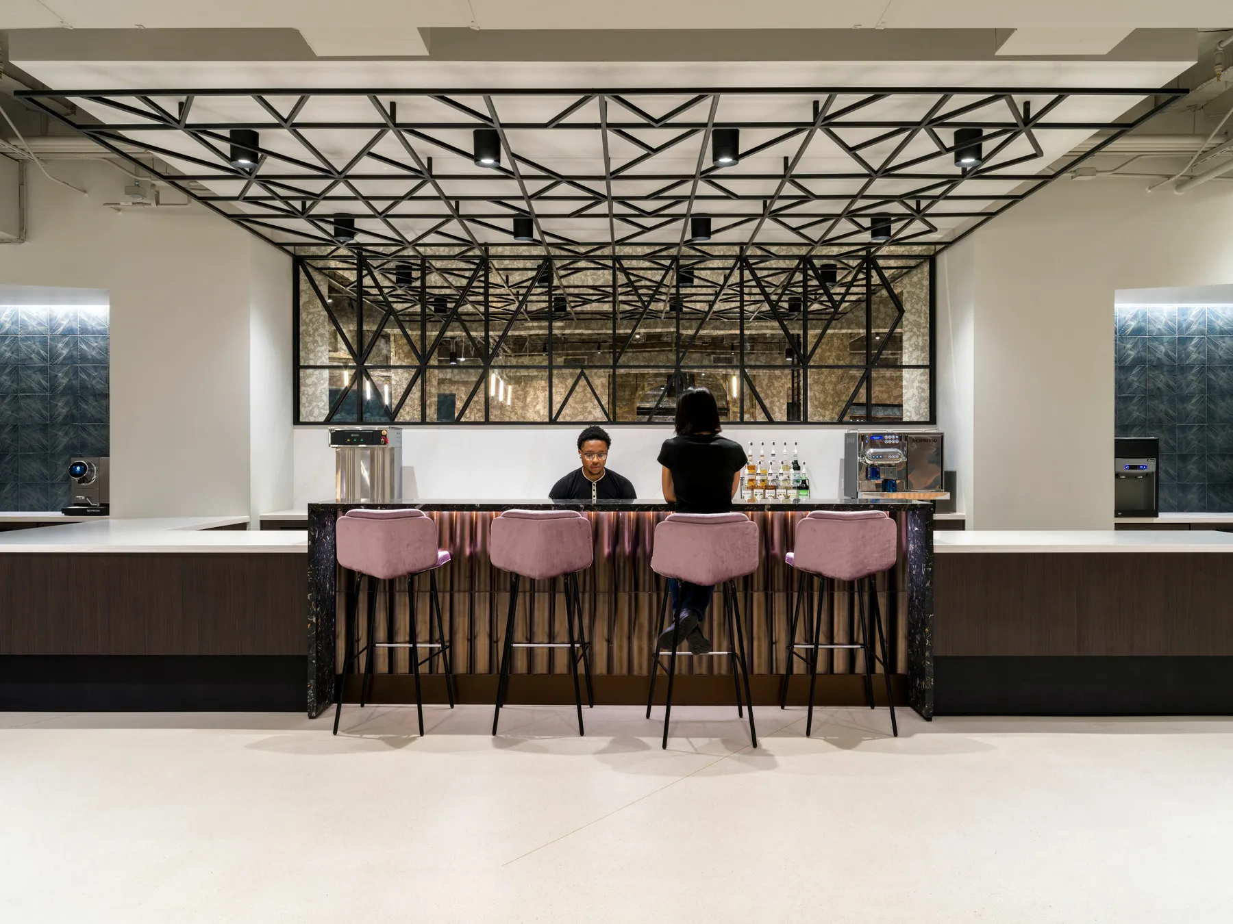 custom ceiling element and space divider in a custom steel tube pattern by Icon Modern