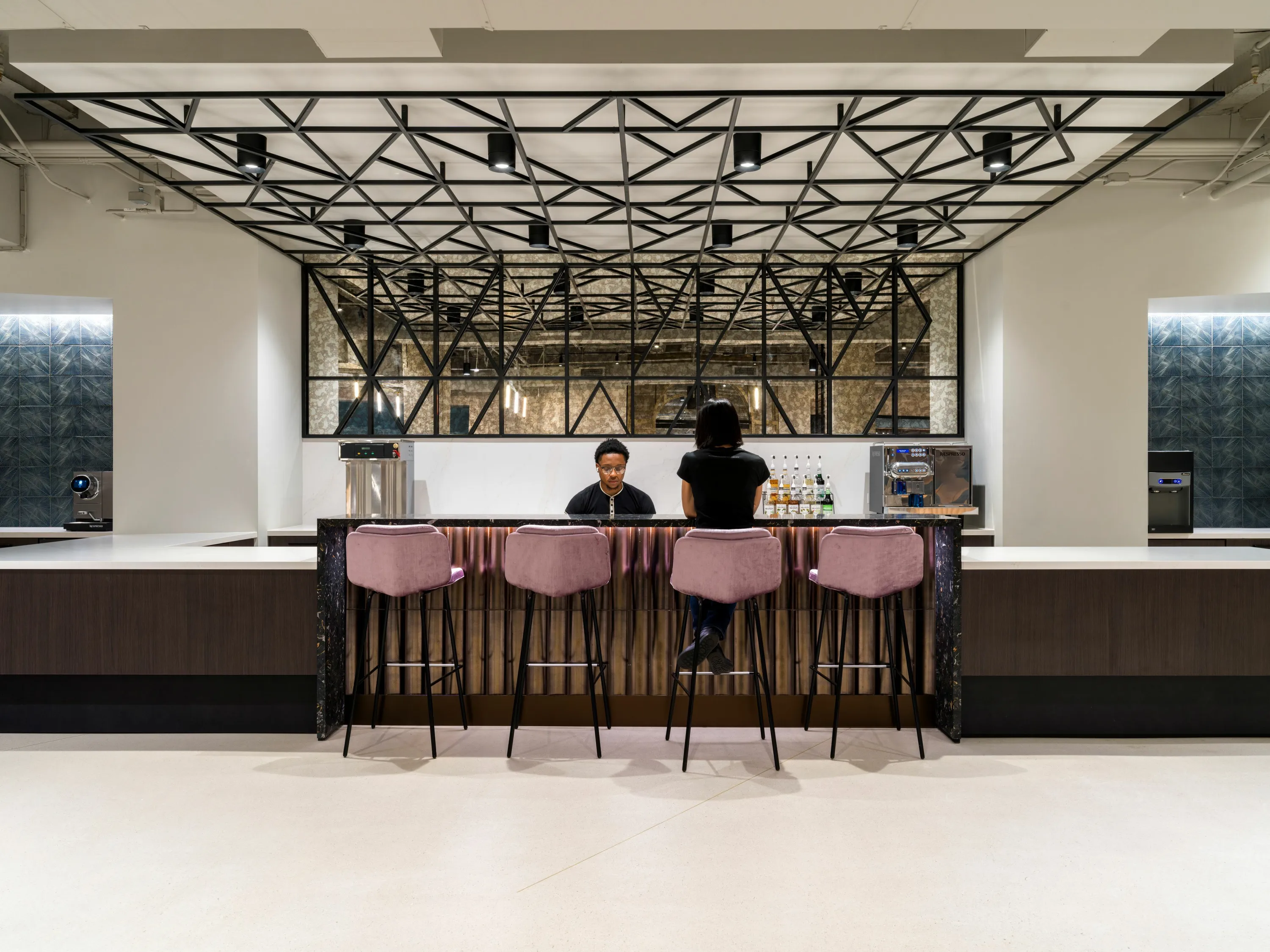 custom ceiling element and space divider in a custom steel tube pattern by Icon Modern