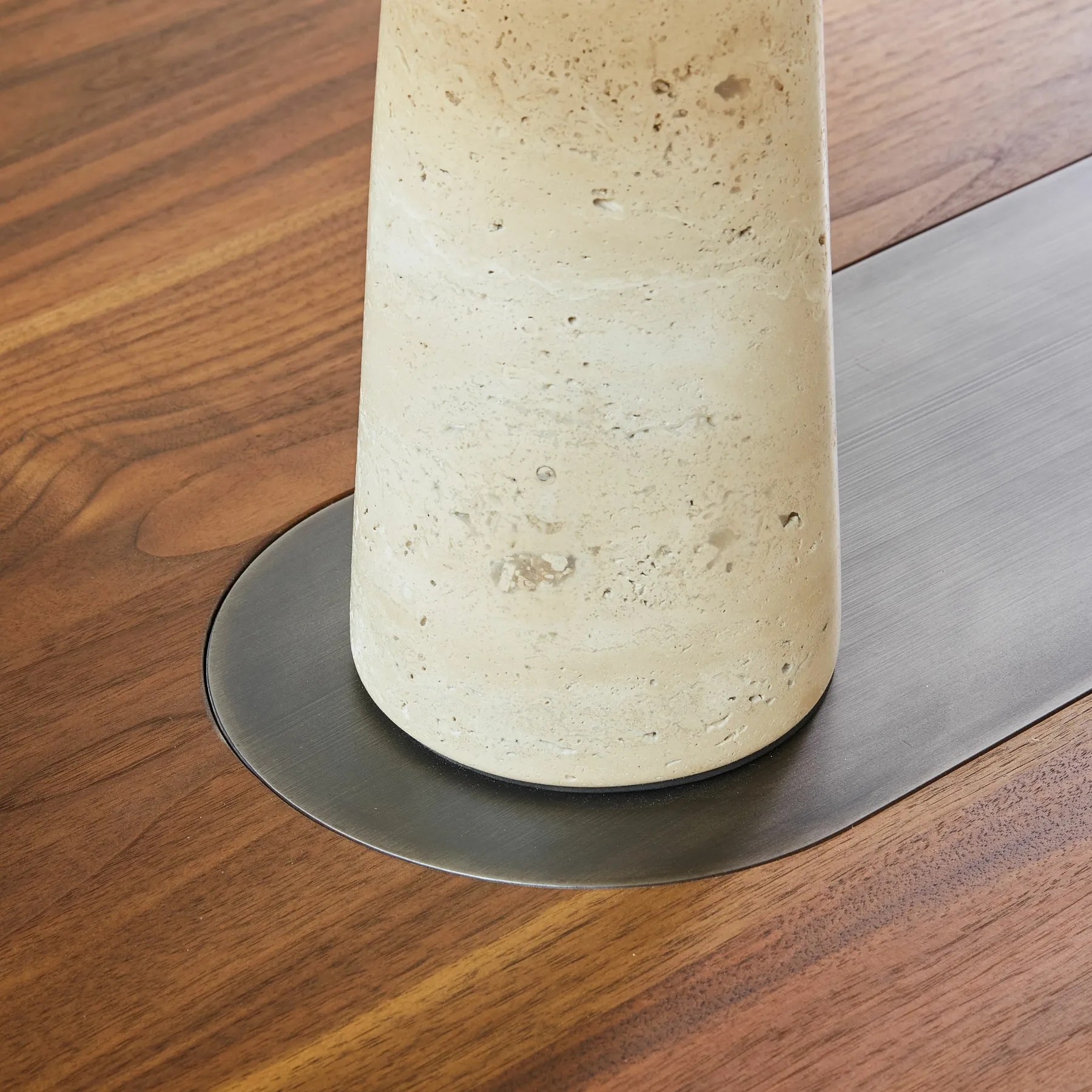 custom metal in-lay in a walnut table by Icon Modern