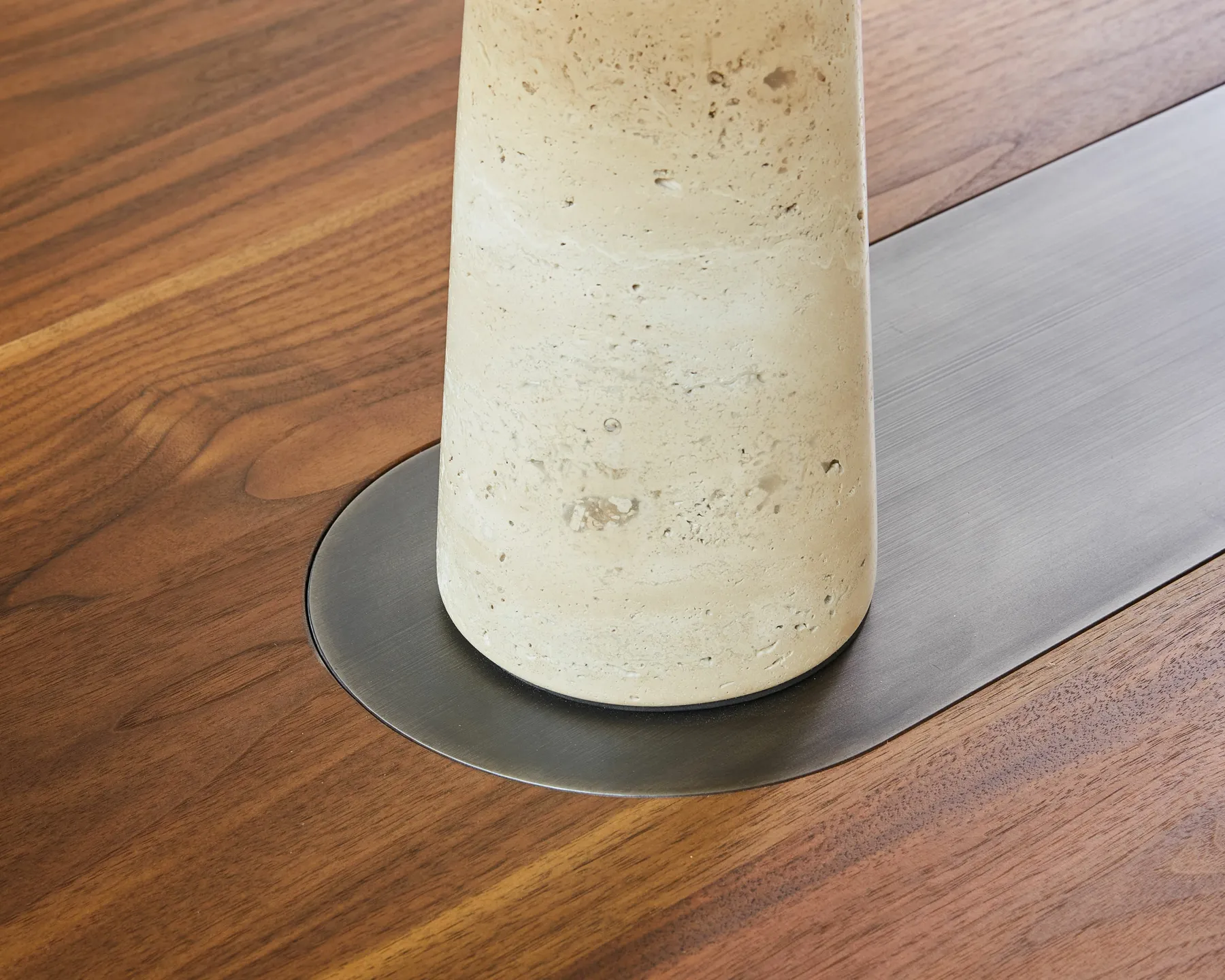custom metal in-lay in a walnut table by Icon Modern