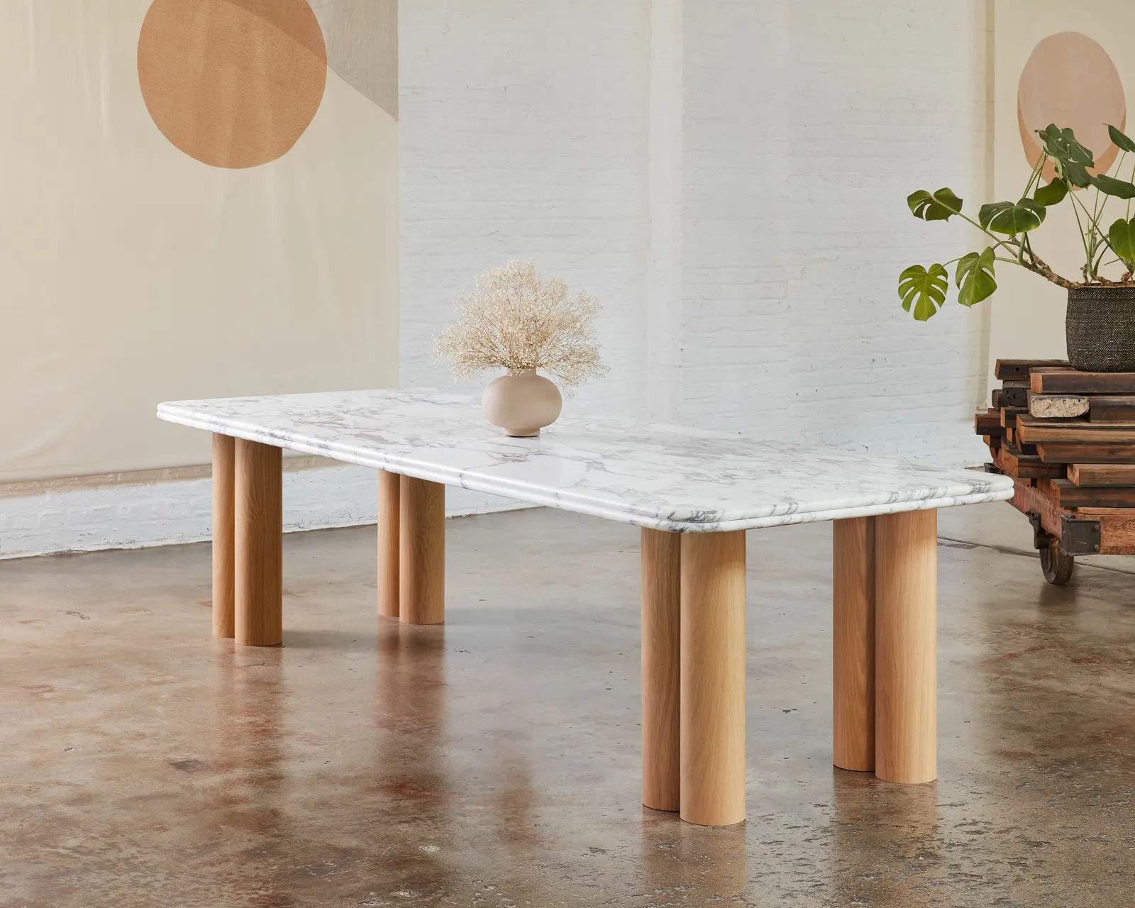 custom stone table with veneer dowel bases by Icon Modern
