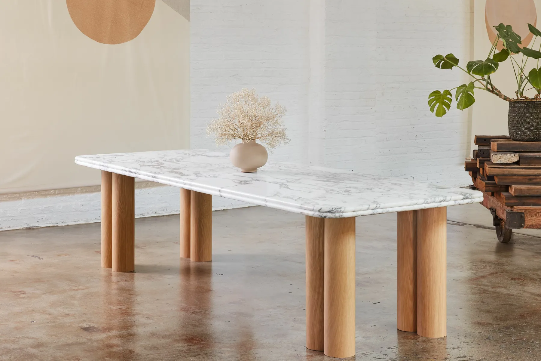 custom stone table with veneer dowel bases by Icon Modern