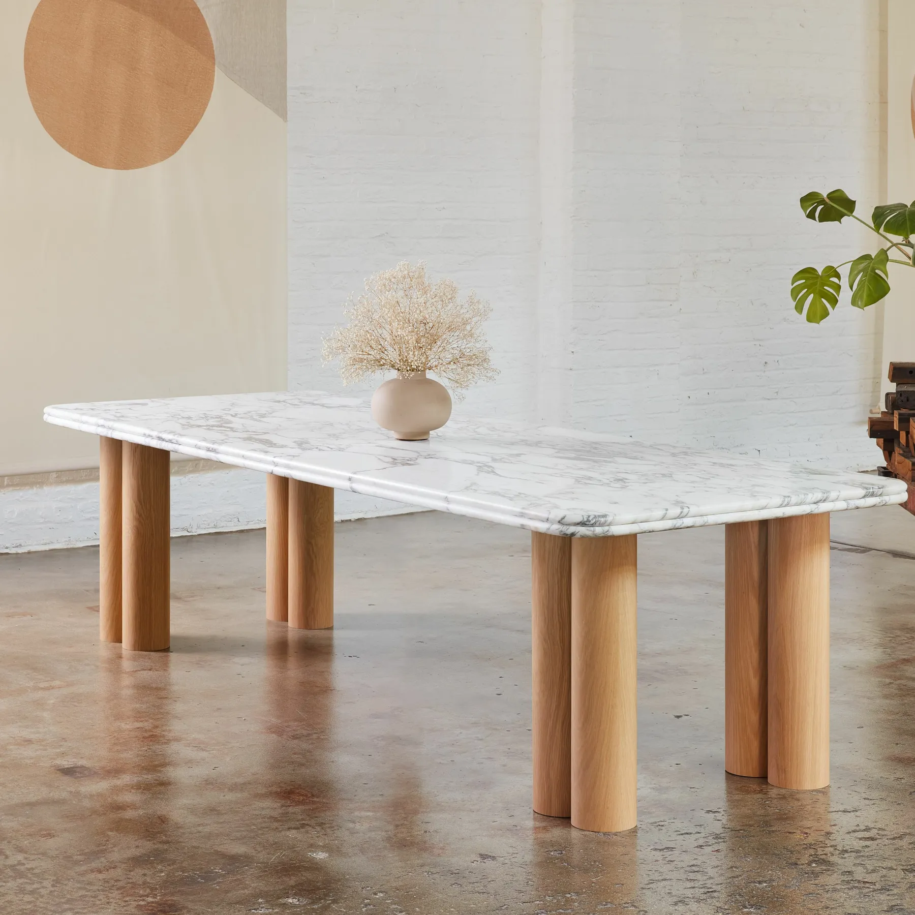 custom stone table with veneer dowel bases by Icon Modern
