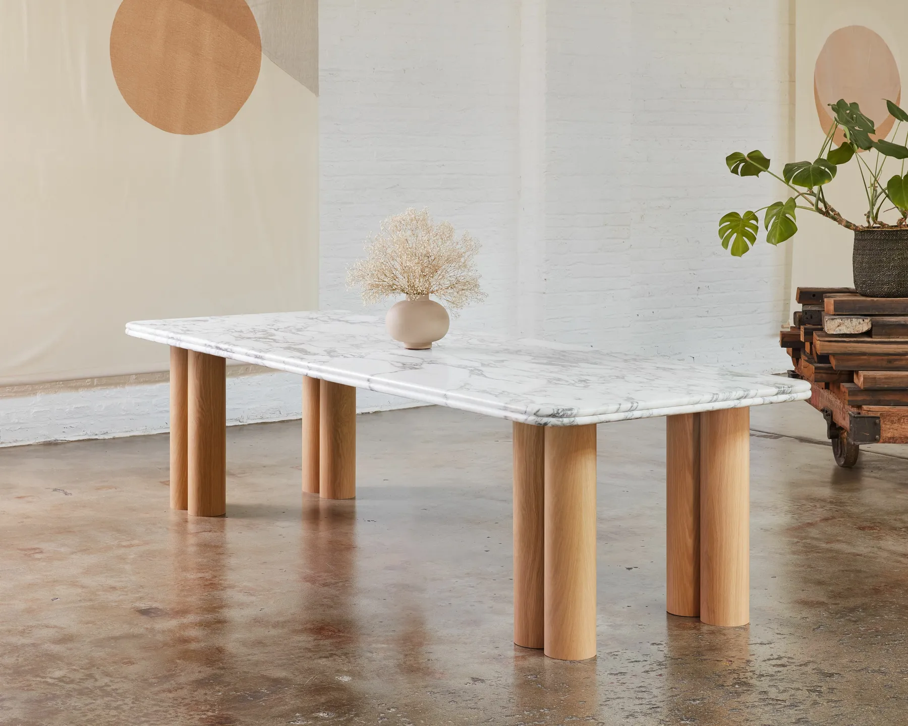 custom stone table with veneer dowel bases by Icon Modern