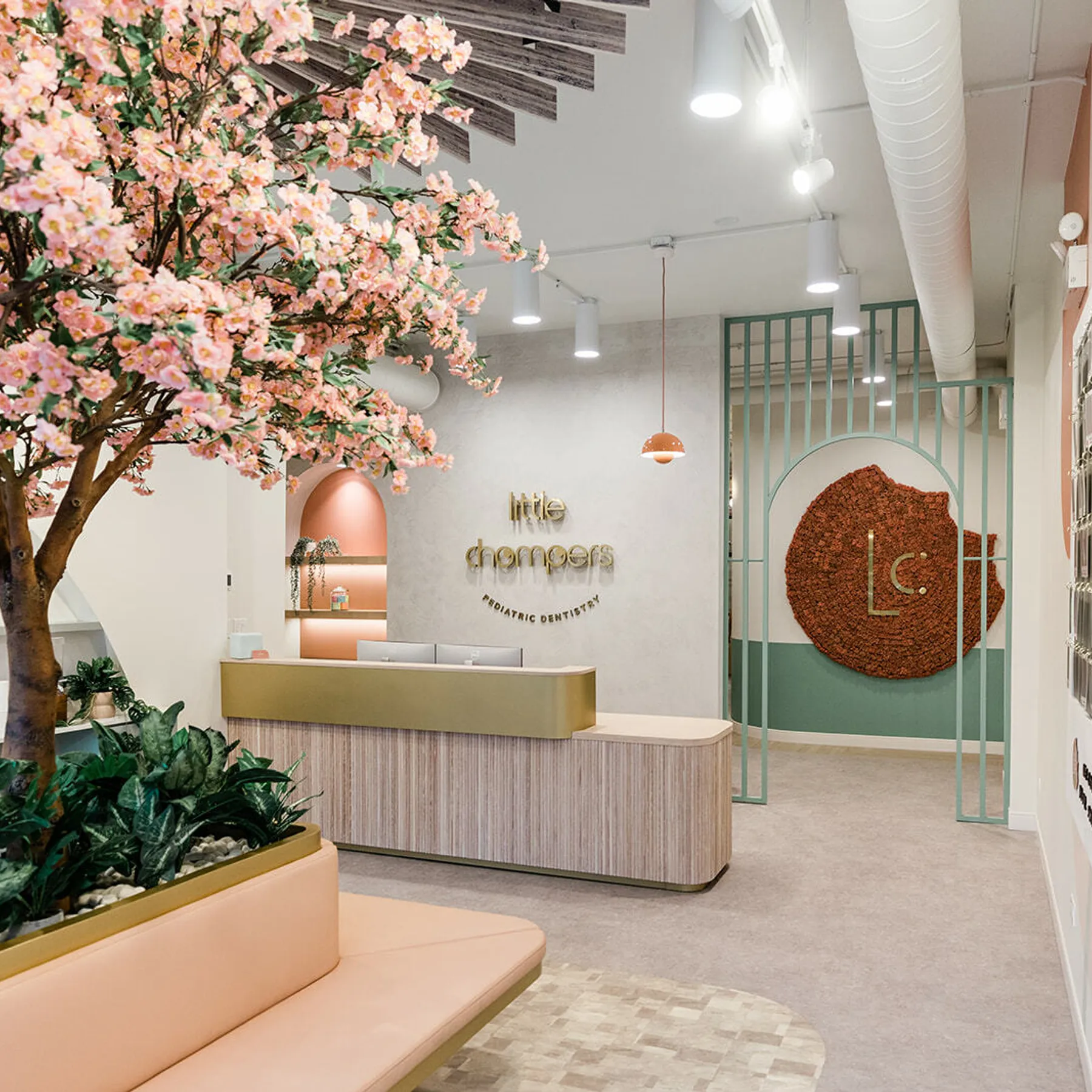 custom reception desk with bench and slatted archway entry by Icon Modern