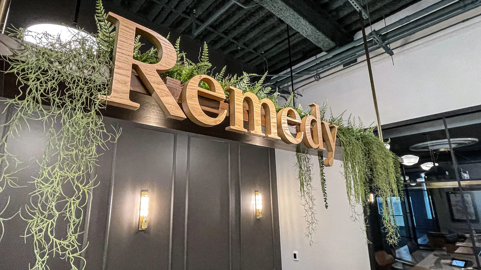 custom signage and and hanging planter by Icon Modern