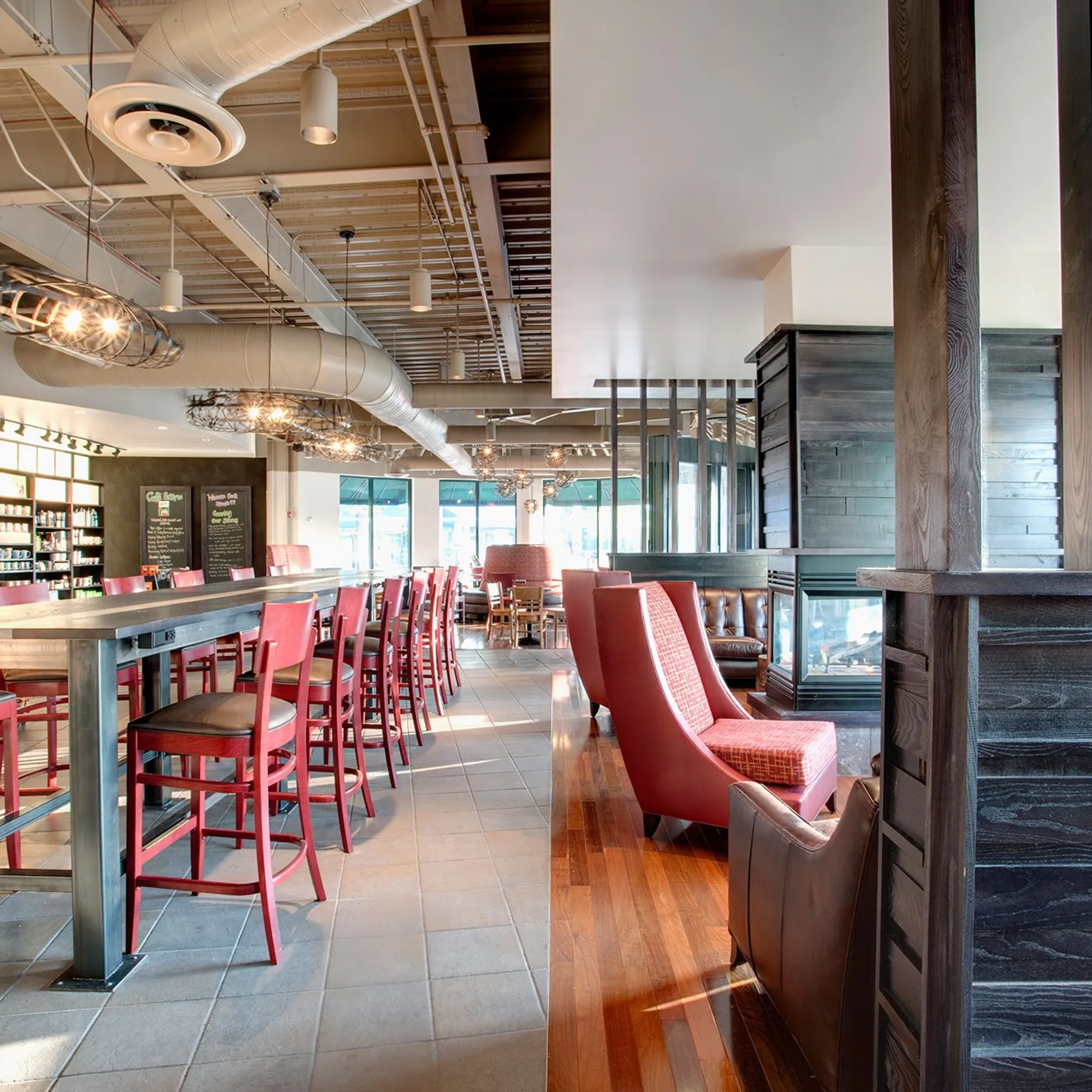 custom community table with steel base by Icon Modern