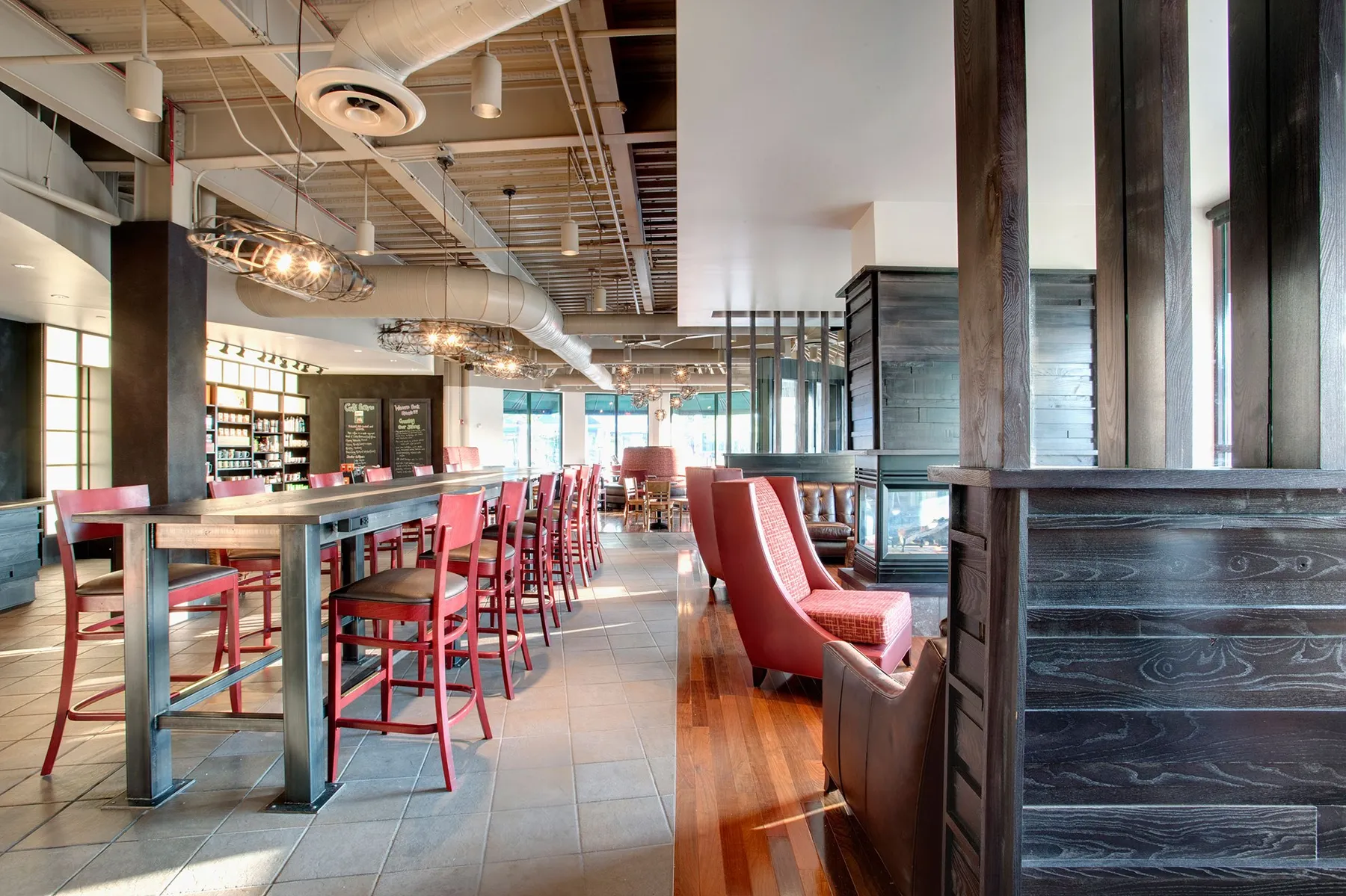 custom community table with steel base by Icon Modern