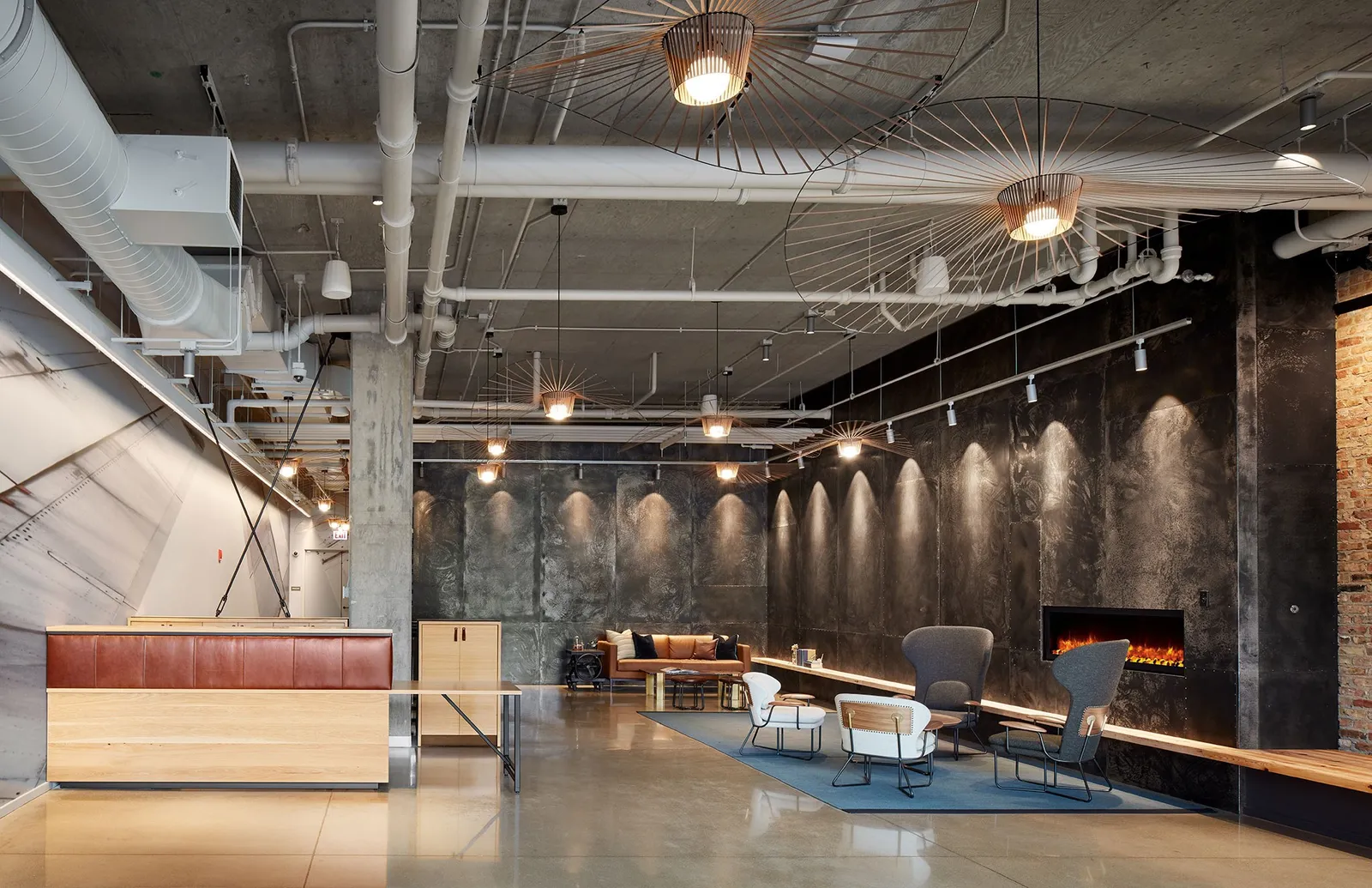custom reception desk in urban oak with leather accents by Icon Modern