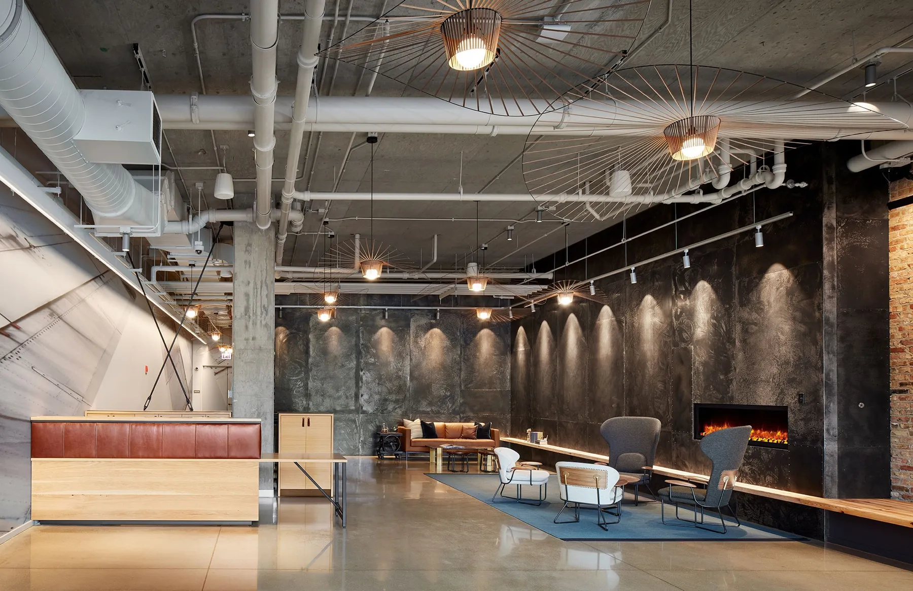 custom reception desk in urban oak with leather accents by Icon Modern