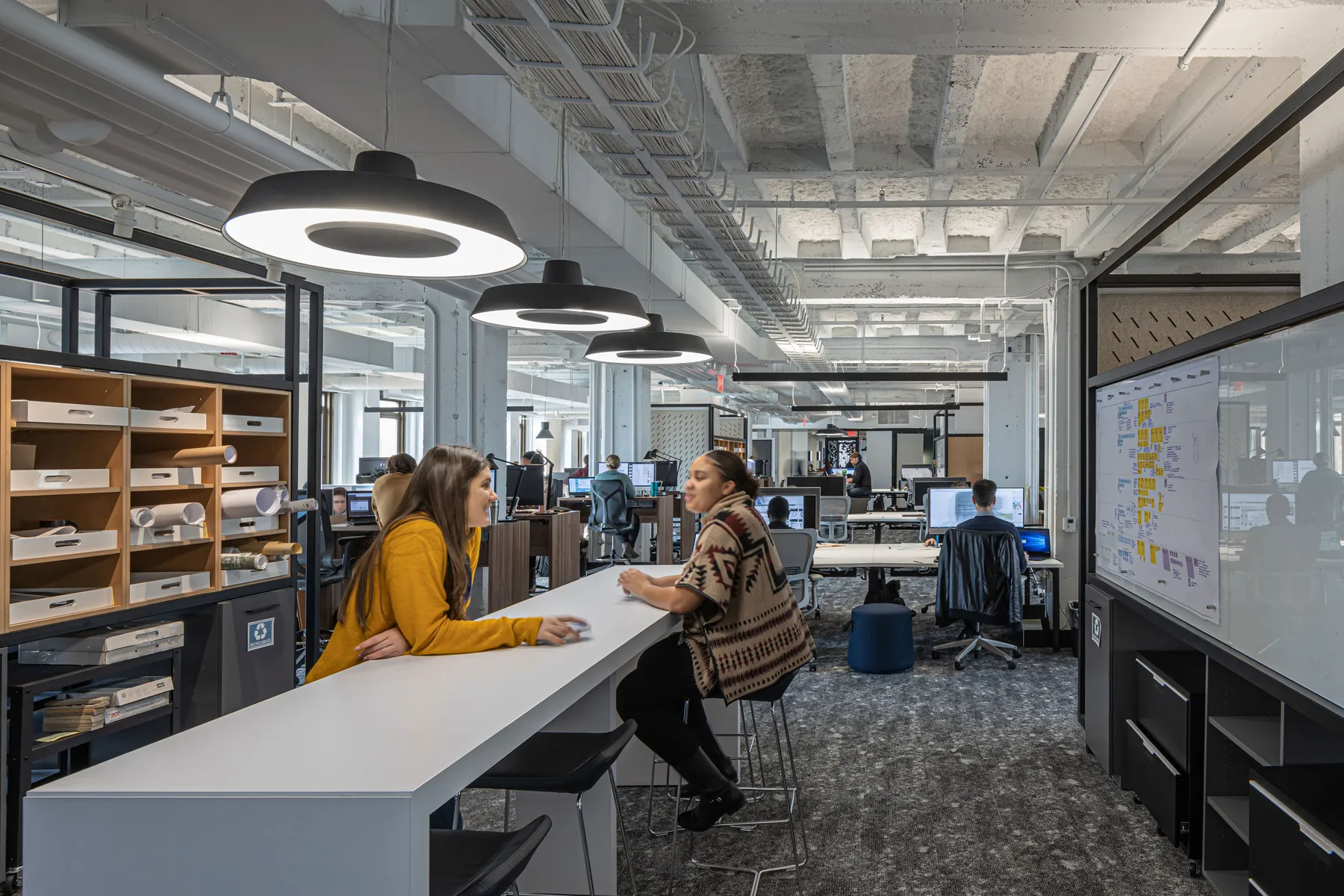 custom working pods in hot rolled steel tubes with whiteboards by Icon Modern