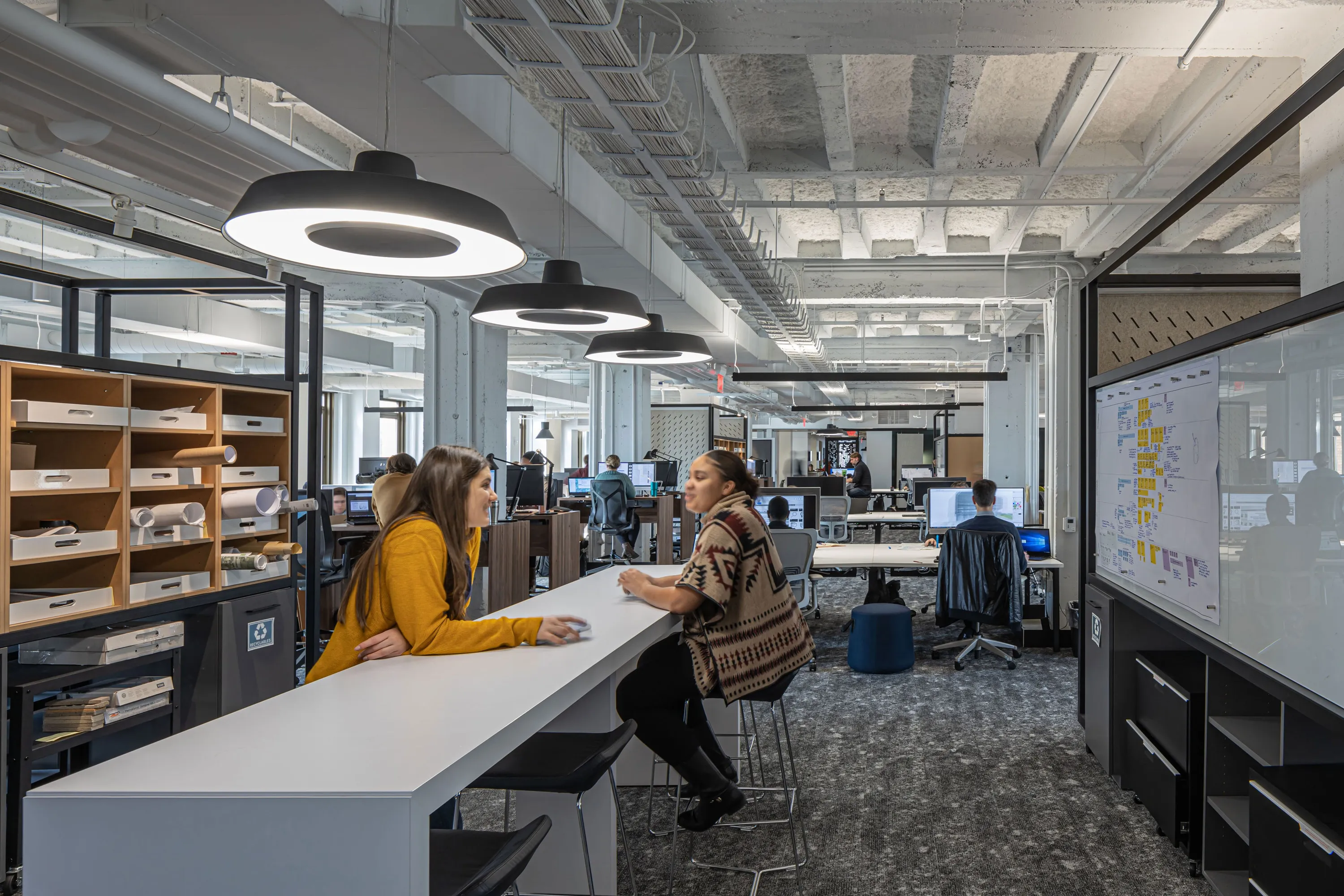 custom working pods in hot rolled steel tubes with whiteboards by Icon Modern