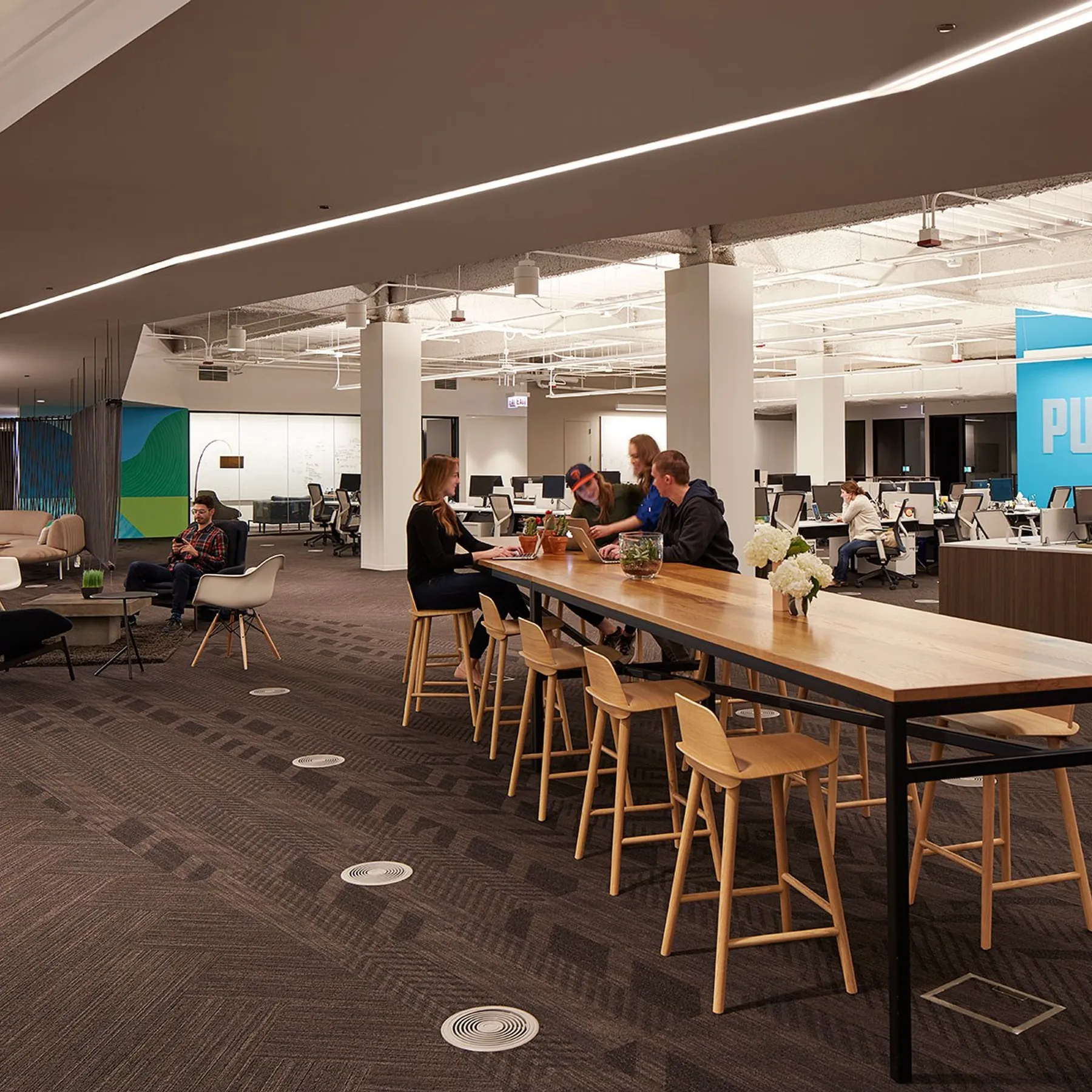 custom community table in urban oak by Icon Modern