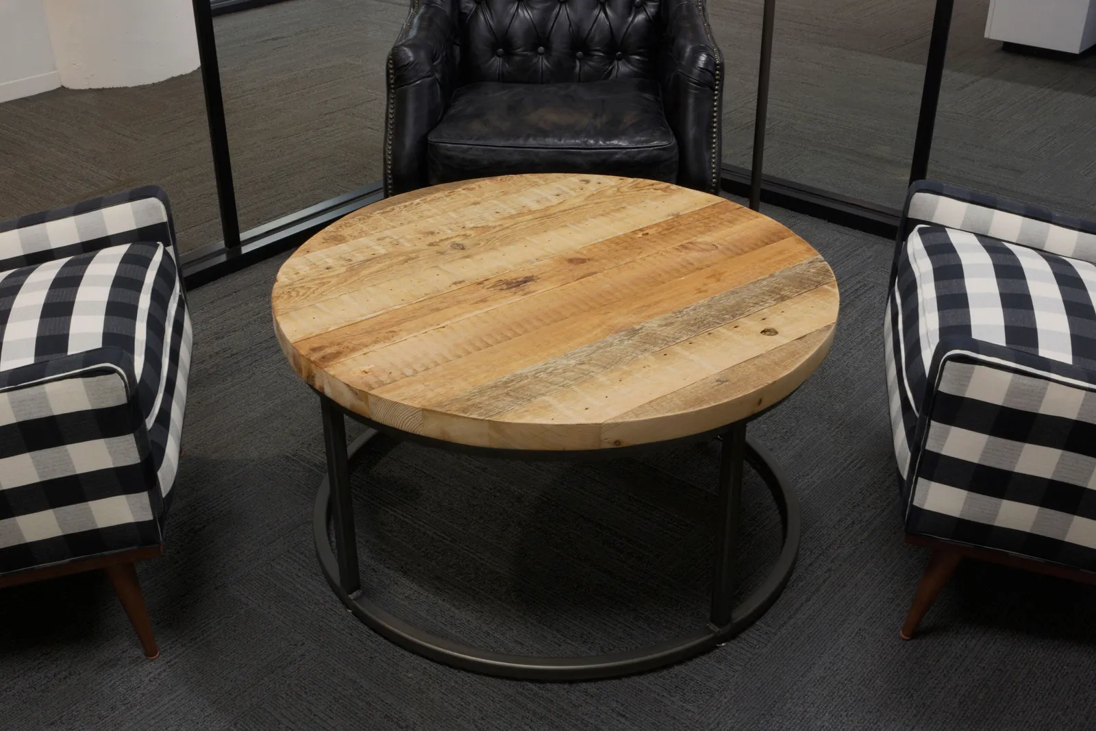 custom coffee table in old growth fir with round steel base by Icon Modern