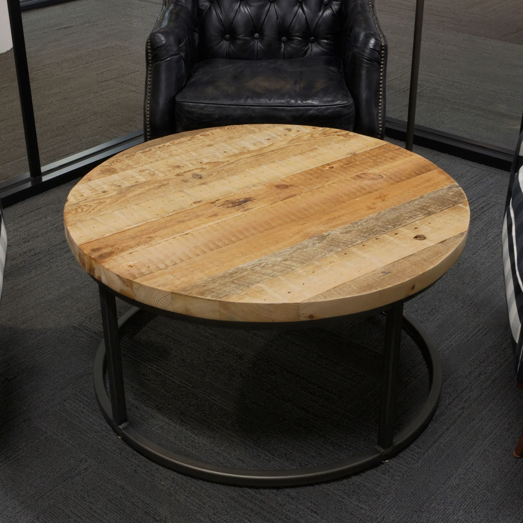 custom coffee table in old growth fir with round steel base by Icon Modern