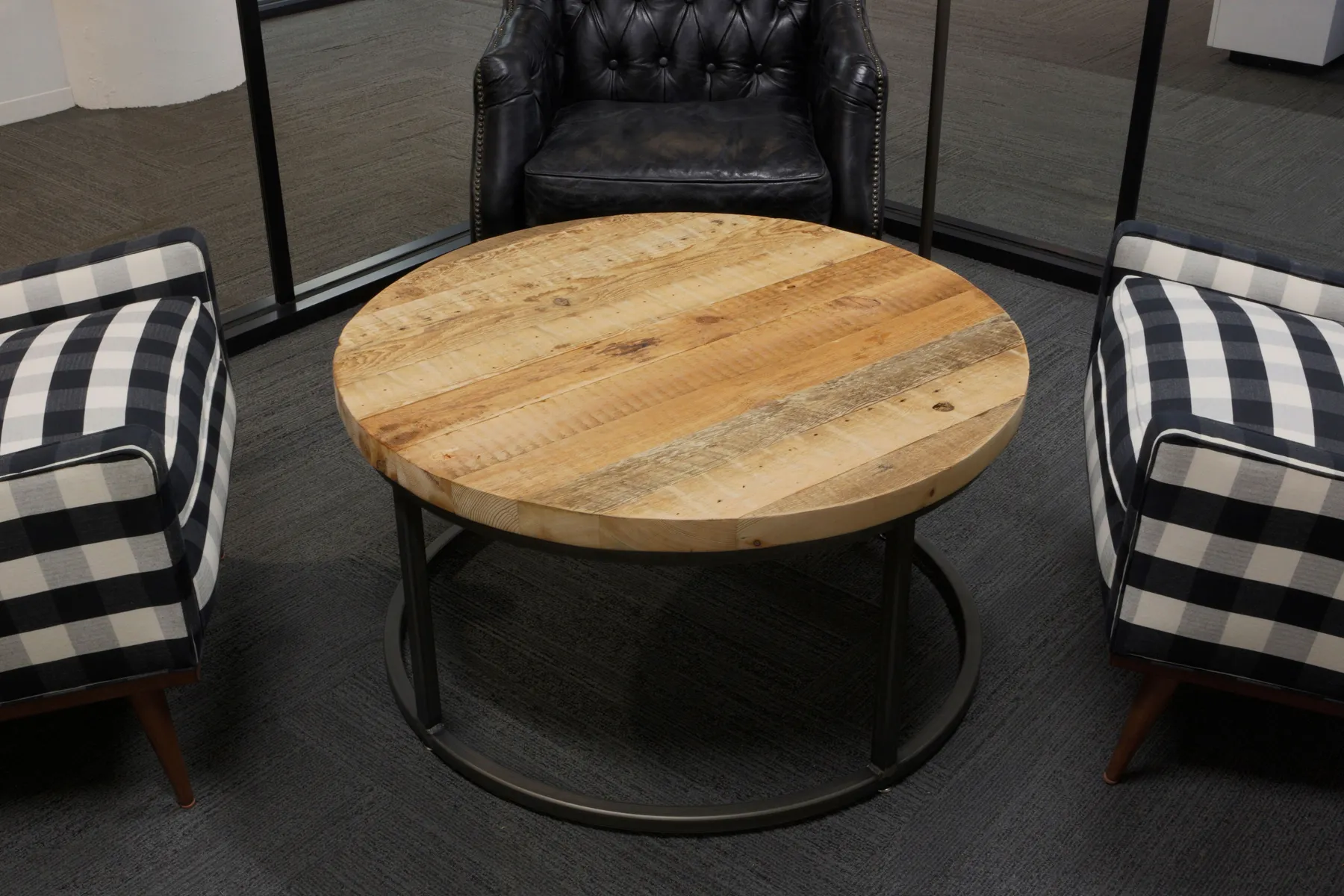 custom coffee table in old growth fir with round steel base by Icon Modern