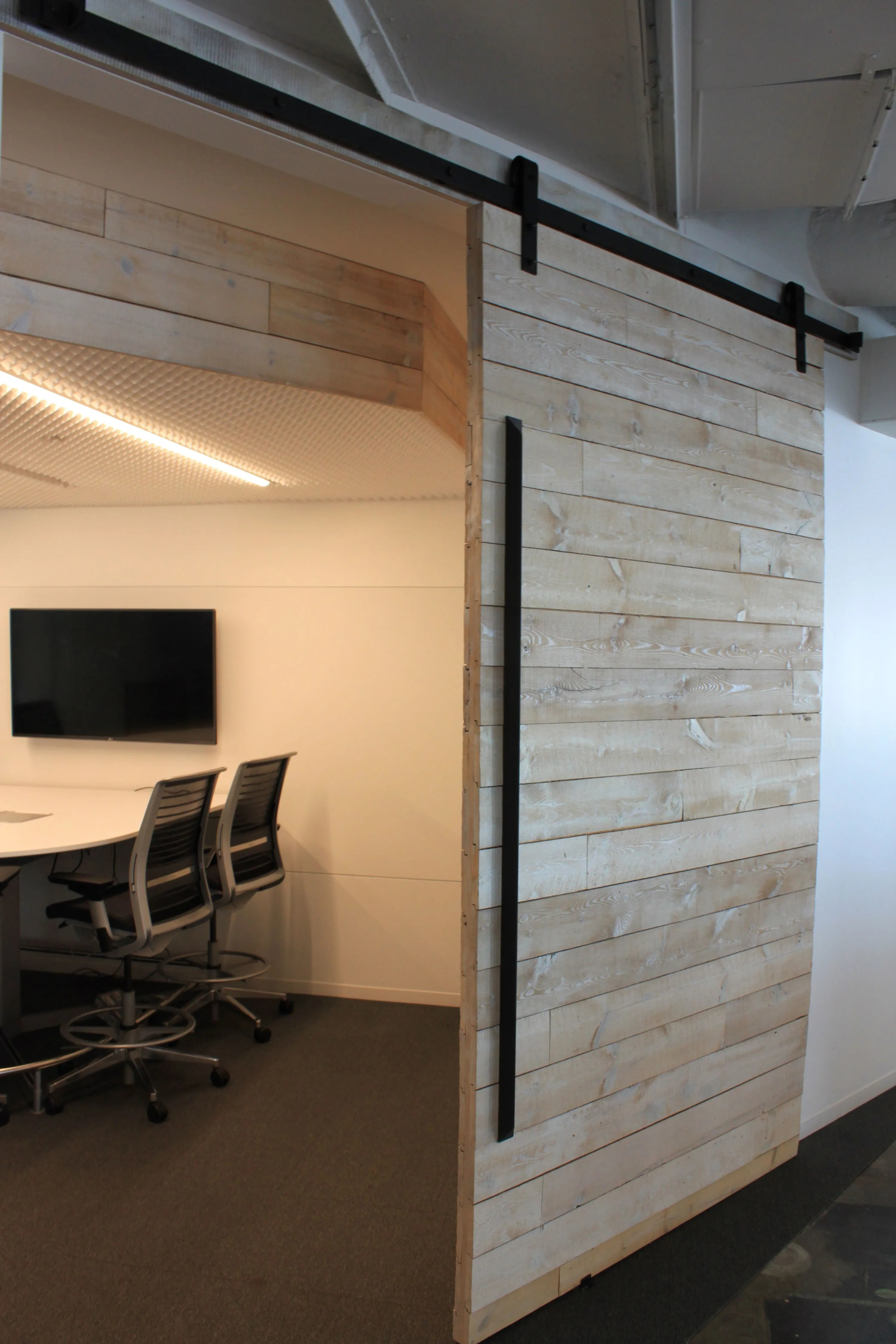 custom barn door in whitewash old growth fir cladding by Icon Modern