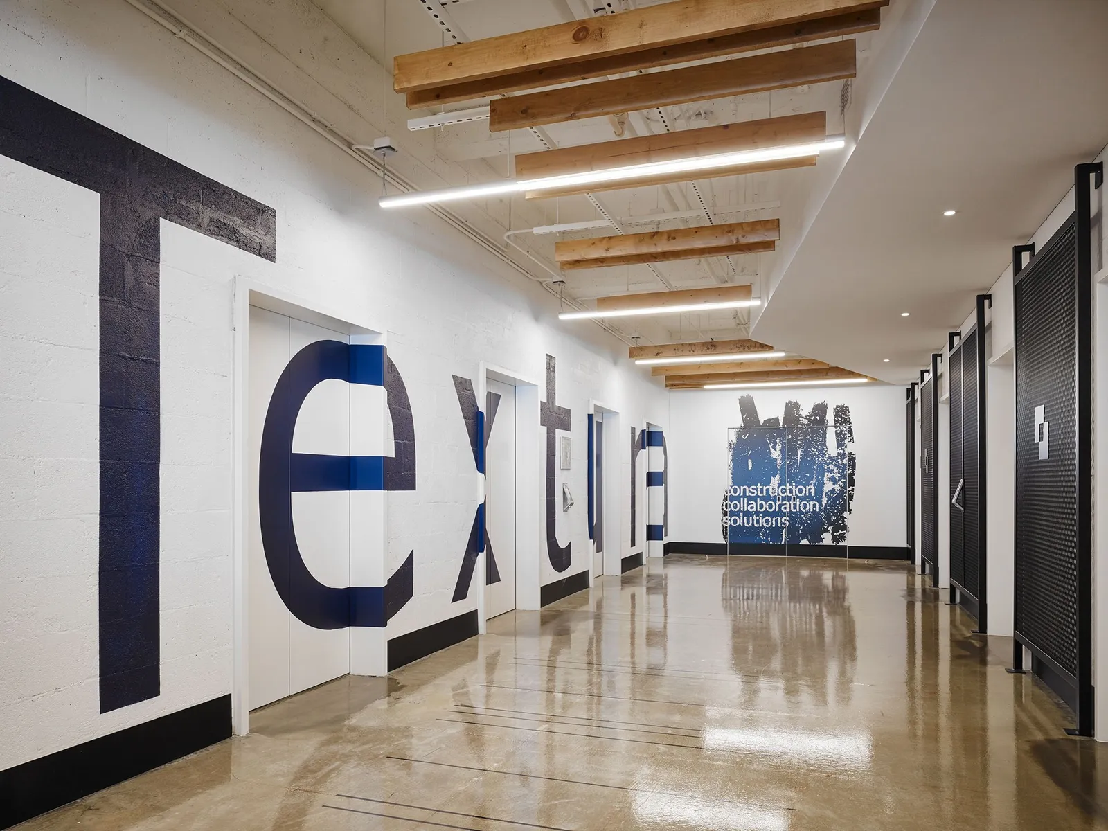 custom wall treatment in expanded metal infill & branding by Icon Modern