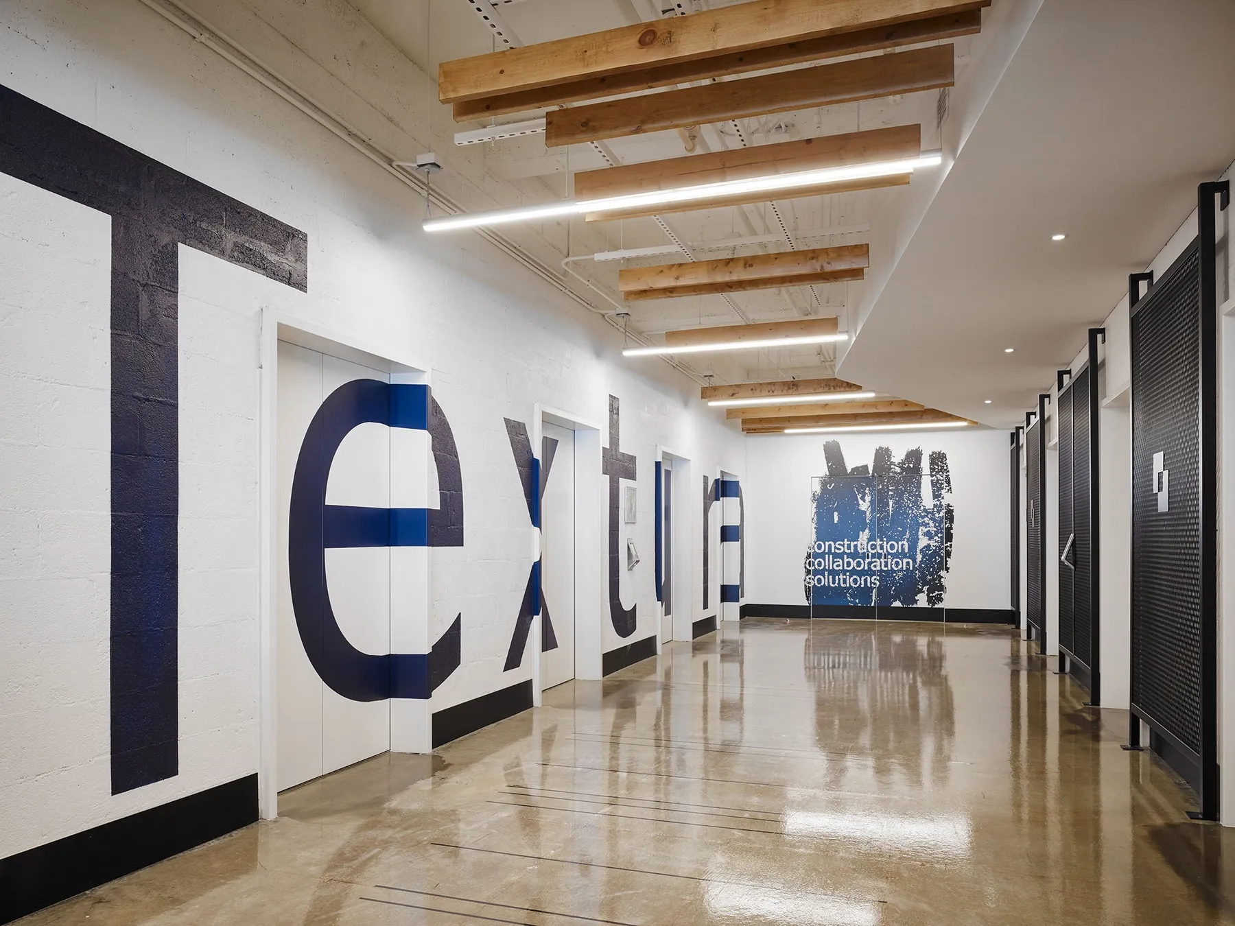 custom wall treatment in expanded metal infill & branding by Icon Modern
