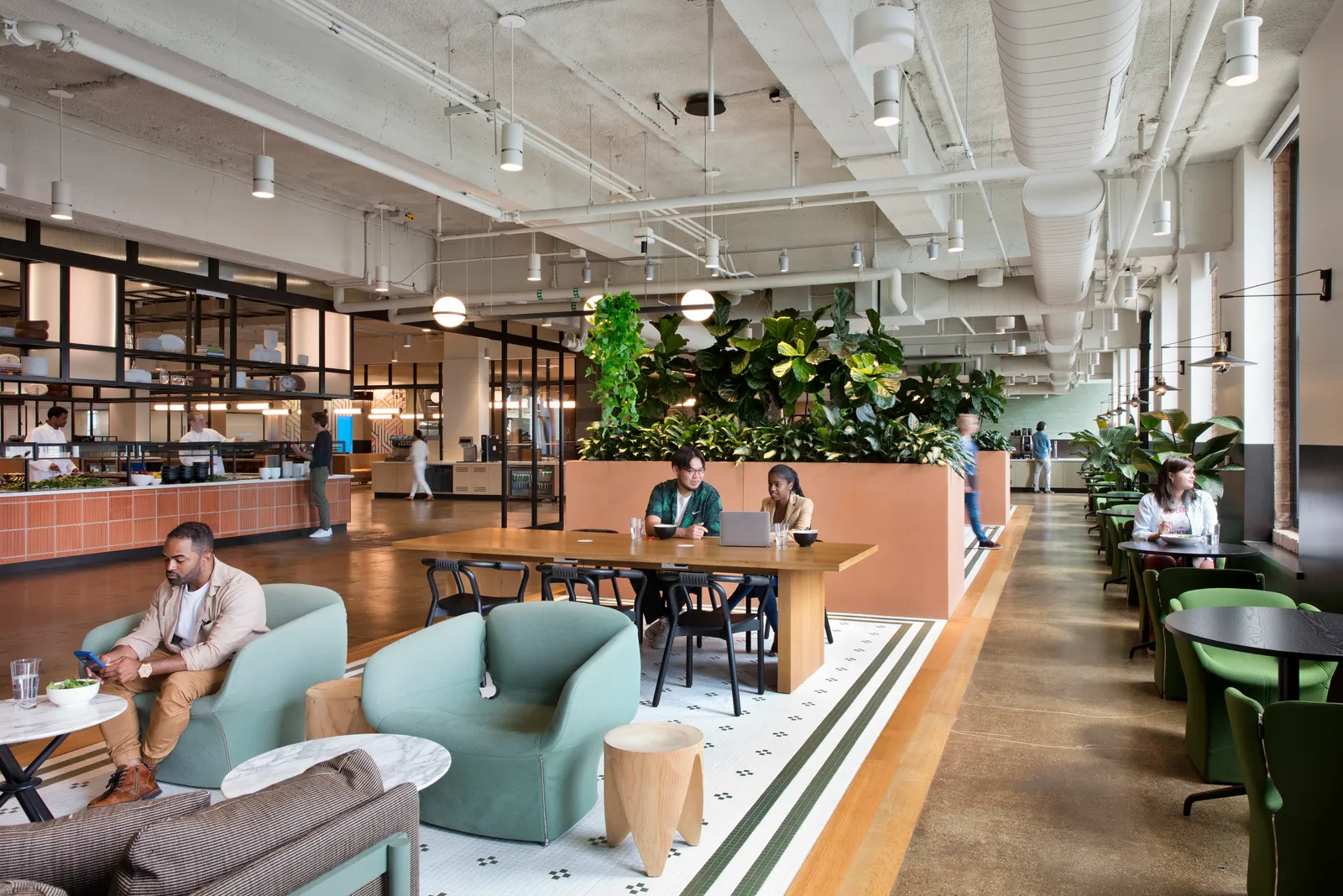 custom work table in oak veneer with panel base and power units by Icon Modern